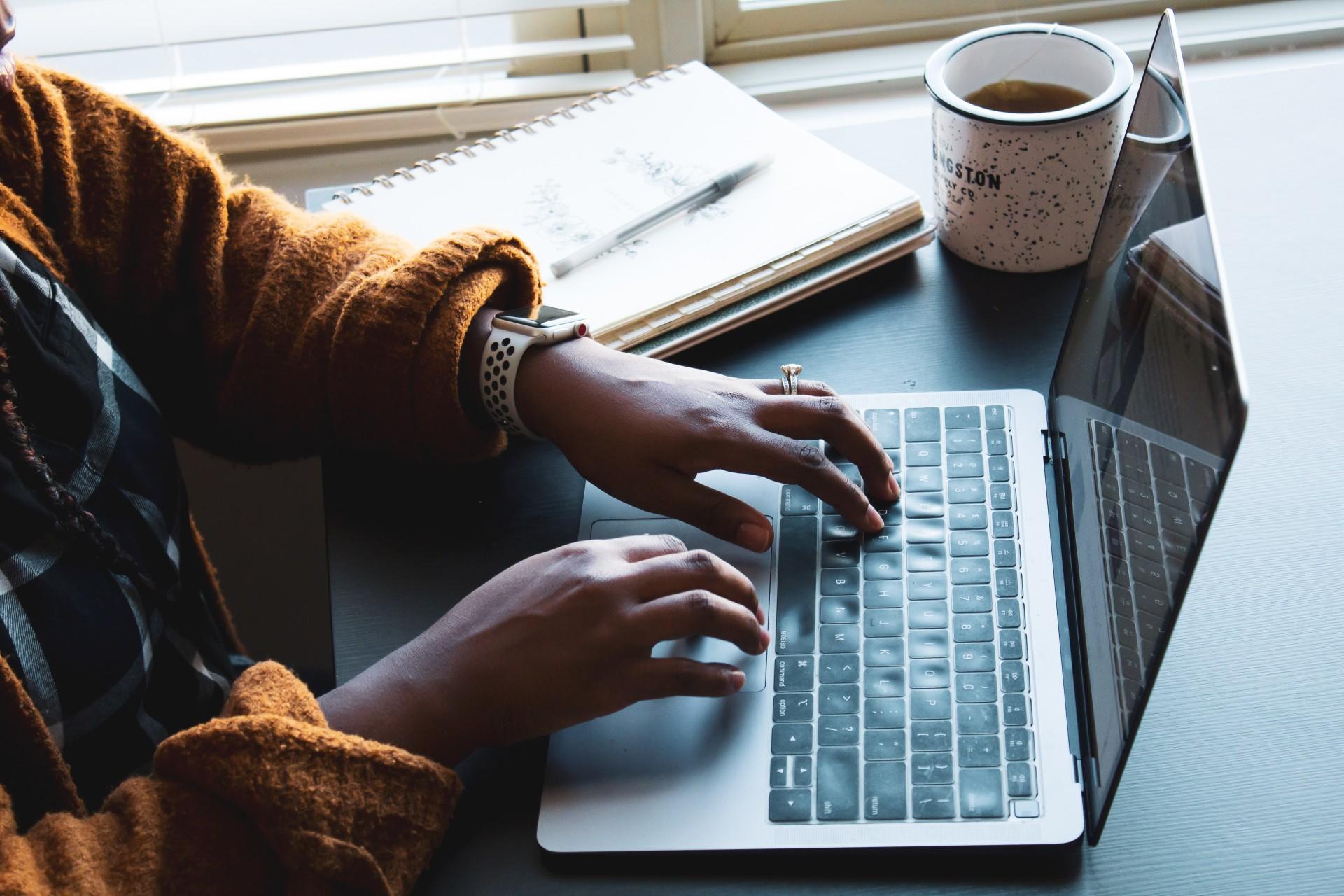 A person typing on a computer