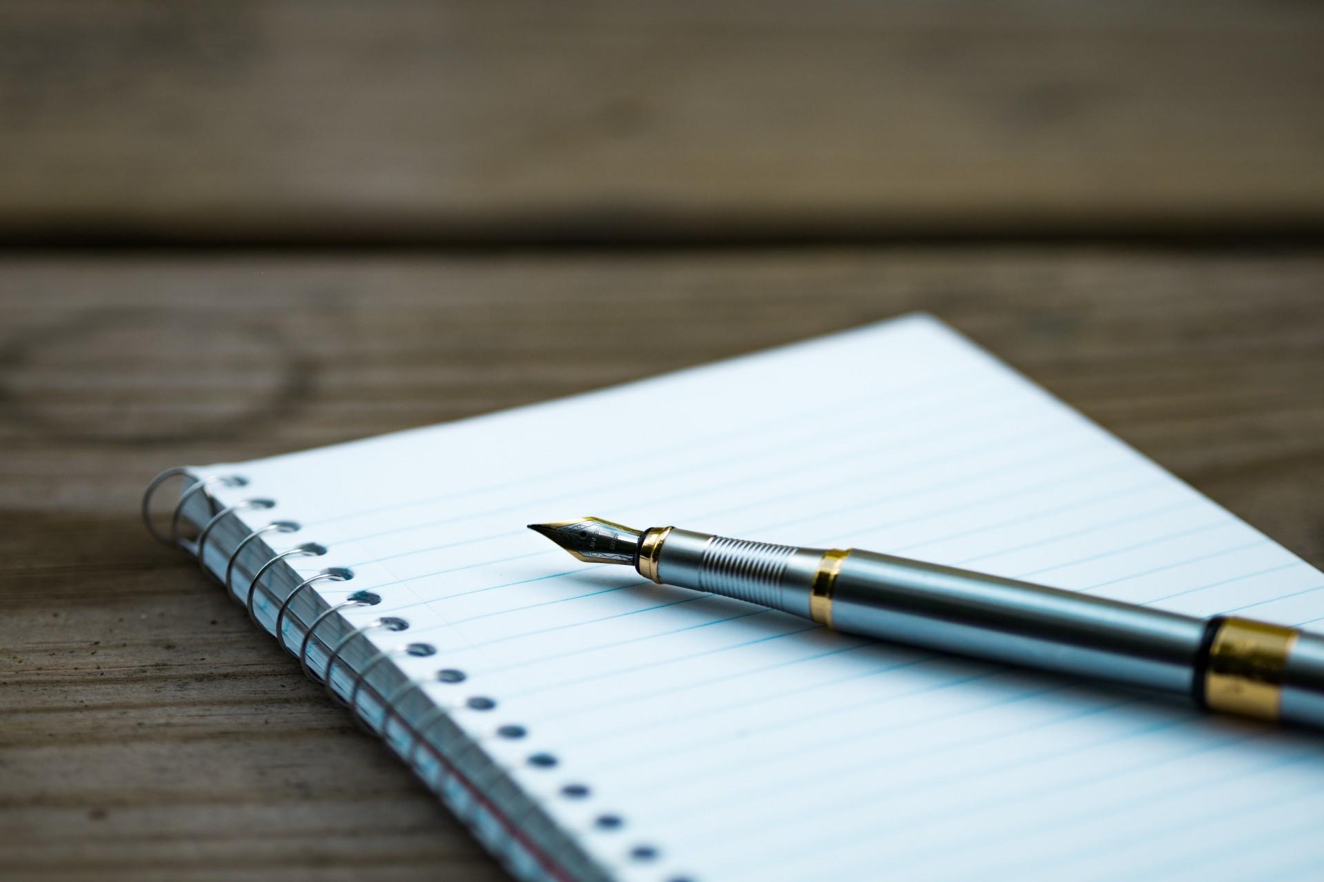 A pen and a notebook