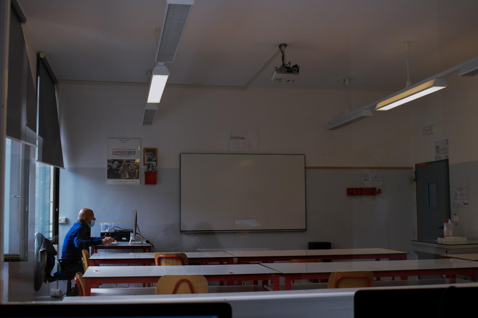 A teacher in front of his computer