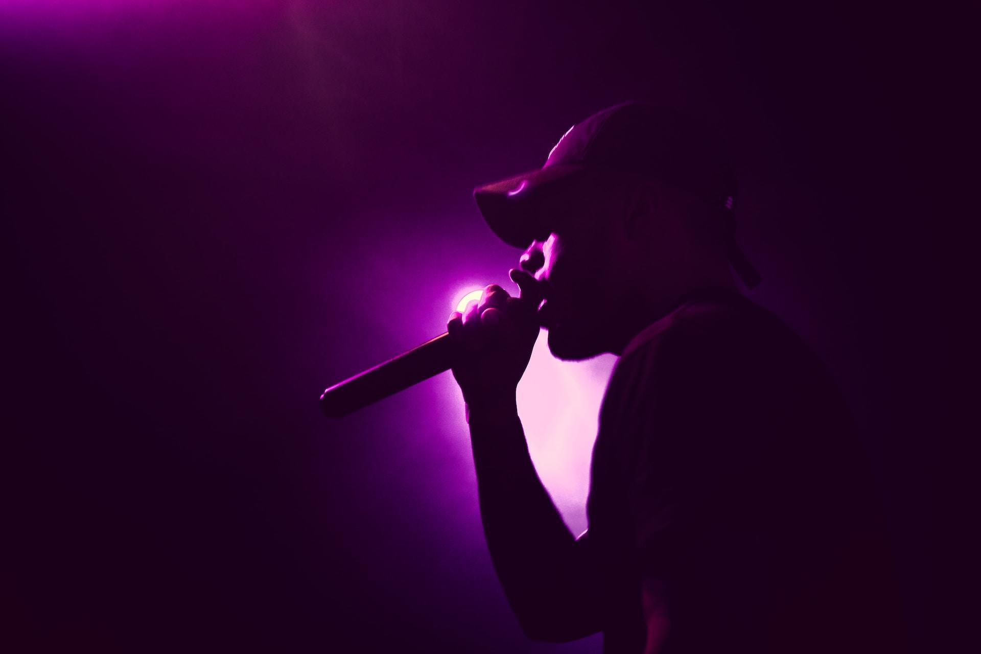 A man singing with a microphone.