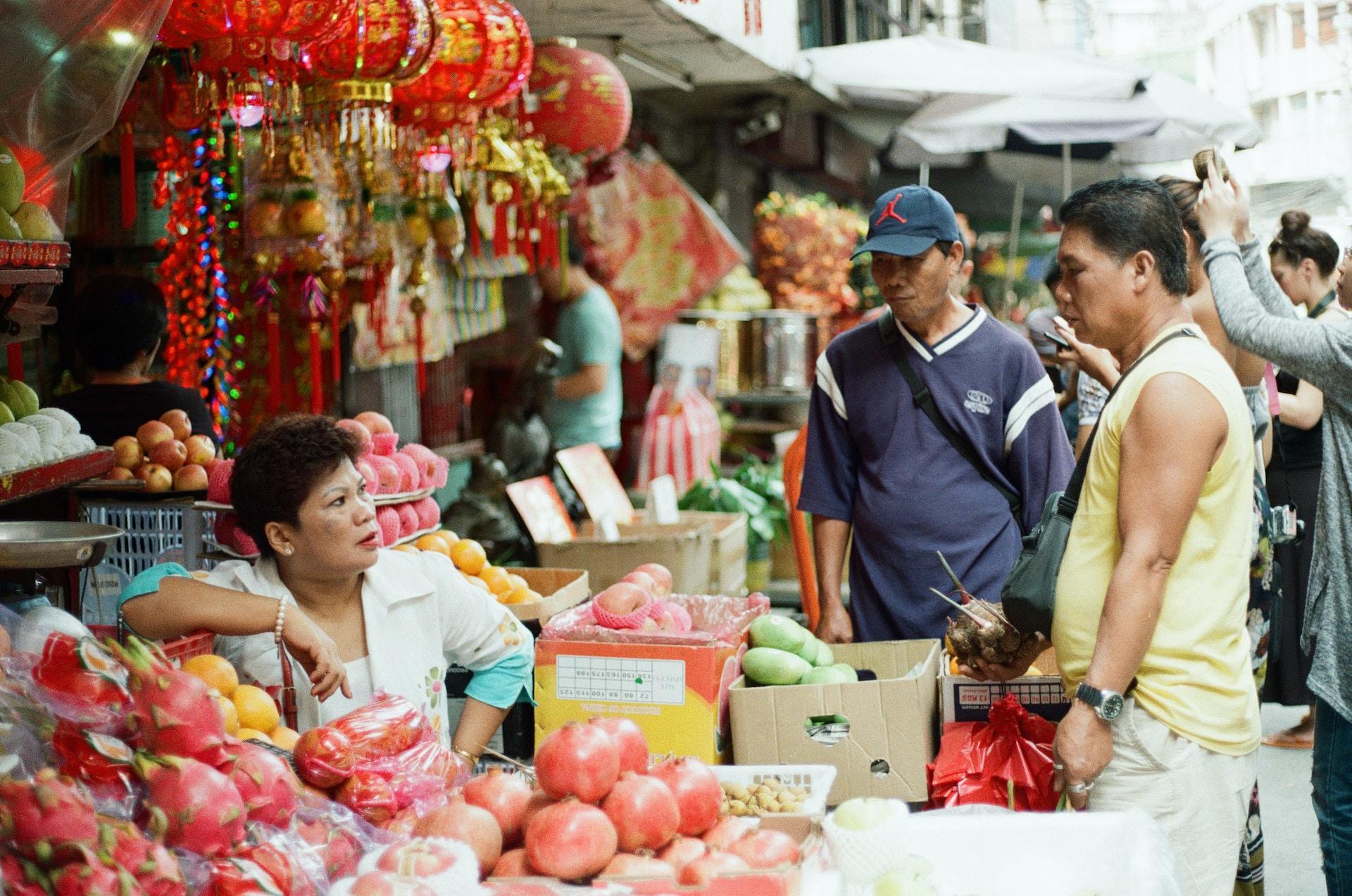 Customers talk to a shopkeeper in China.
