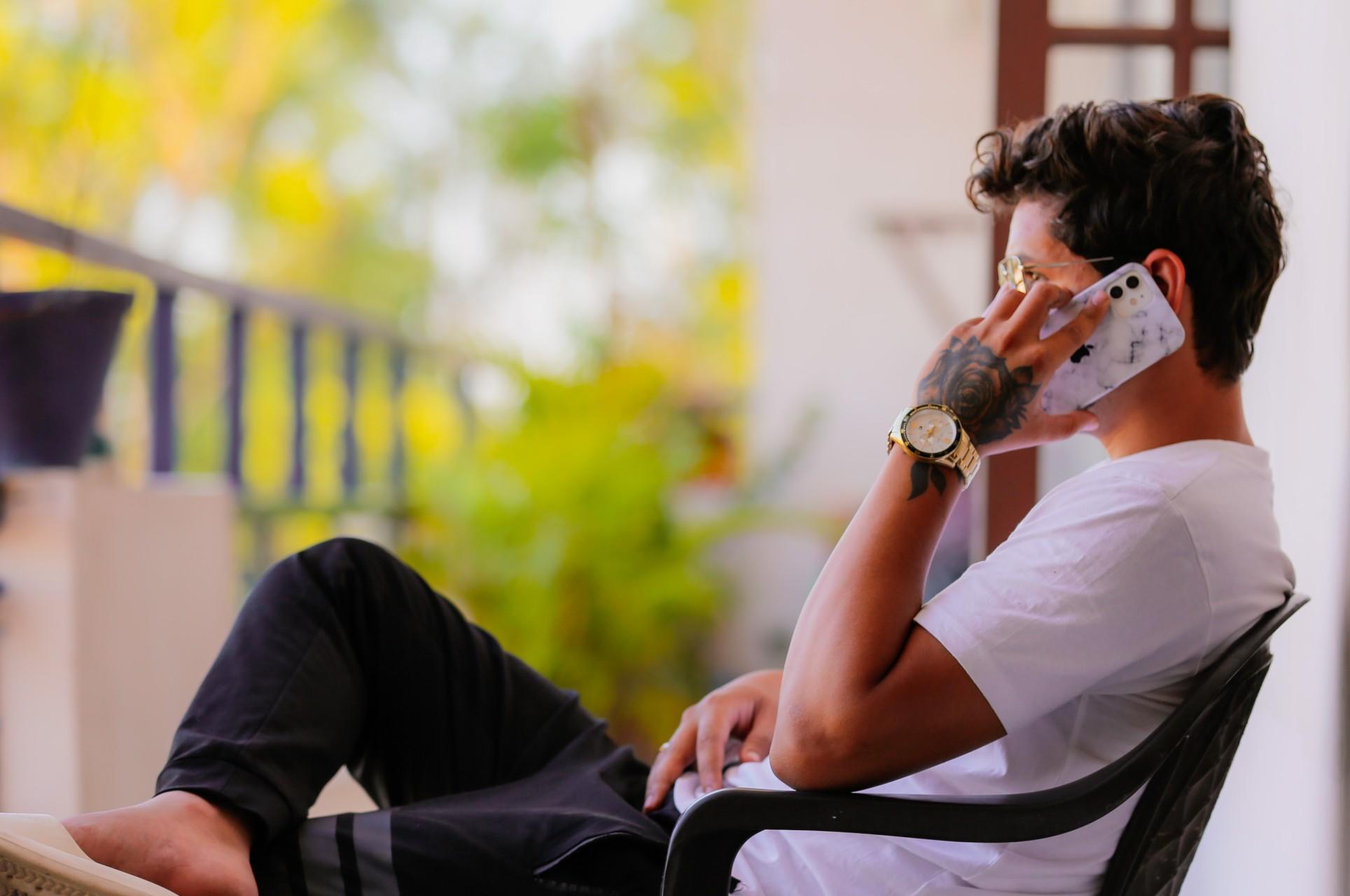 A man speaking on the phone