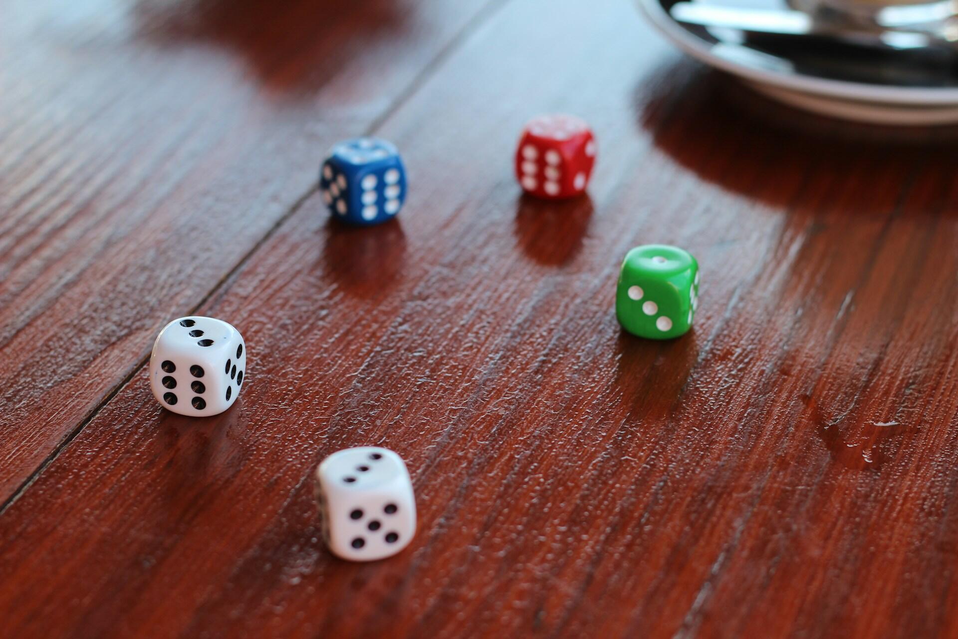 Five dice on a table.