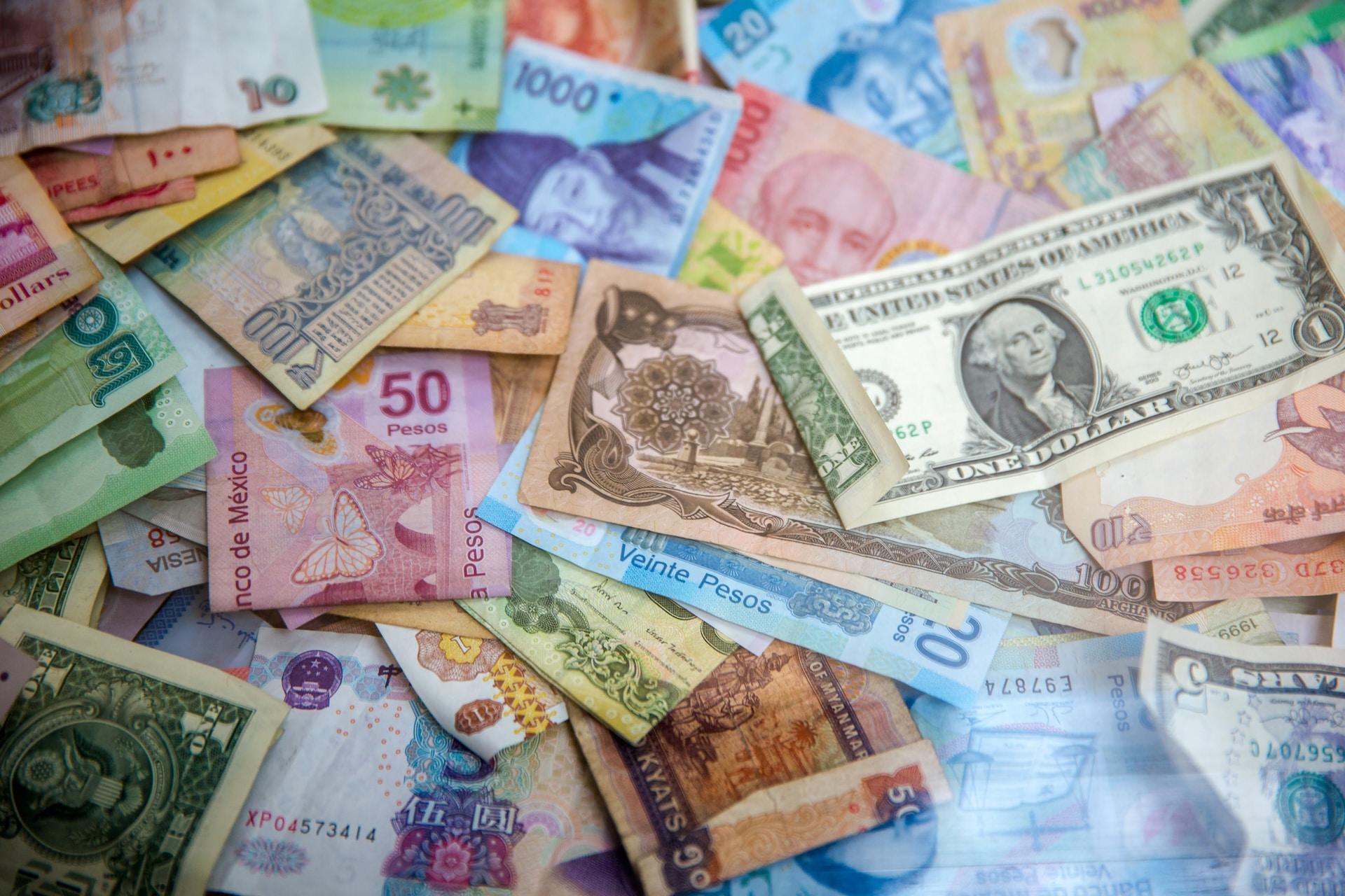 A pile of banknotes from around the world.