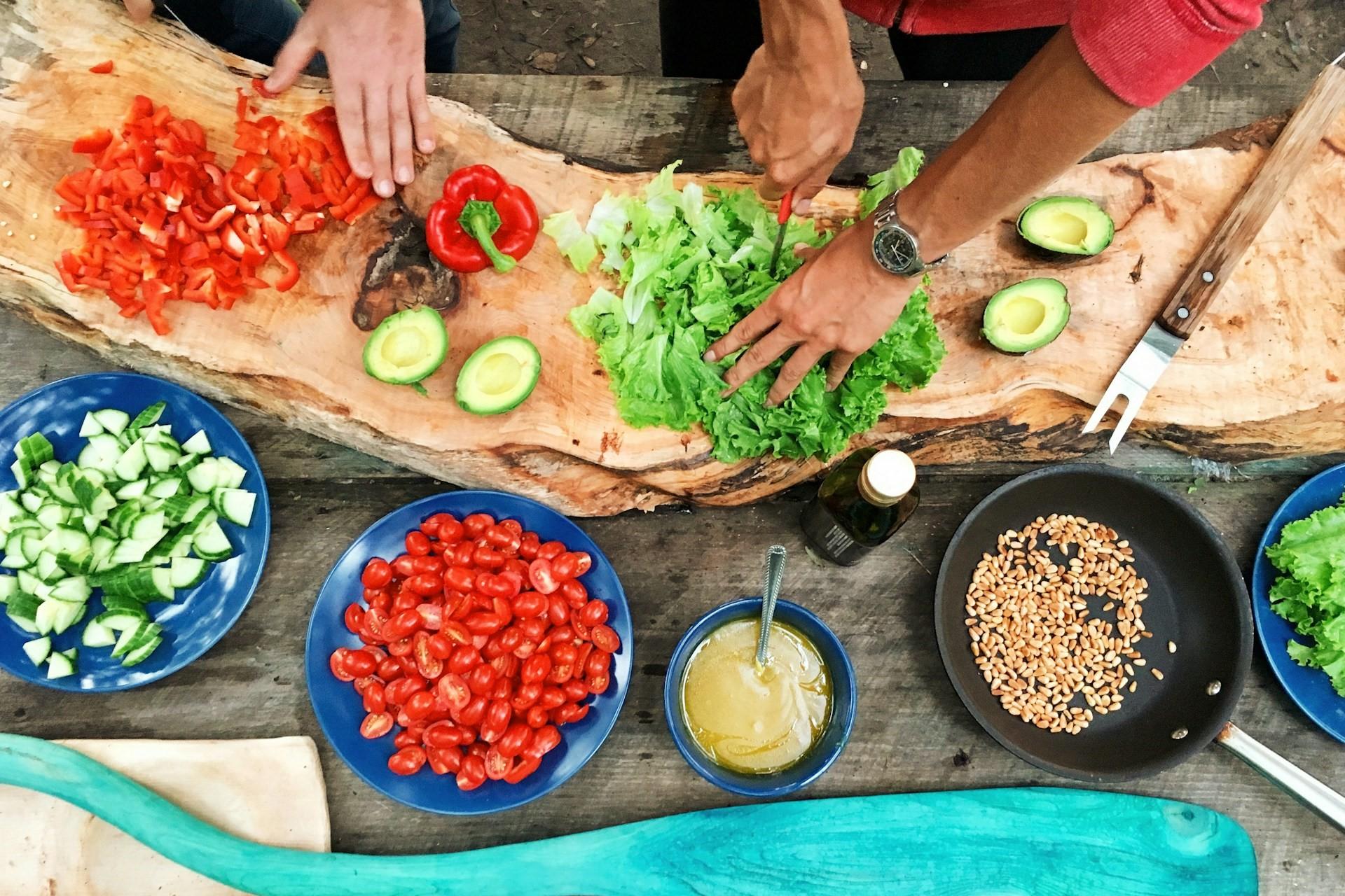 People preparing food to cook.