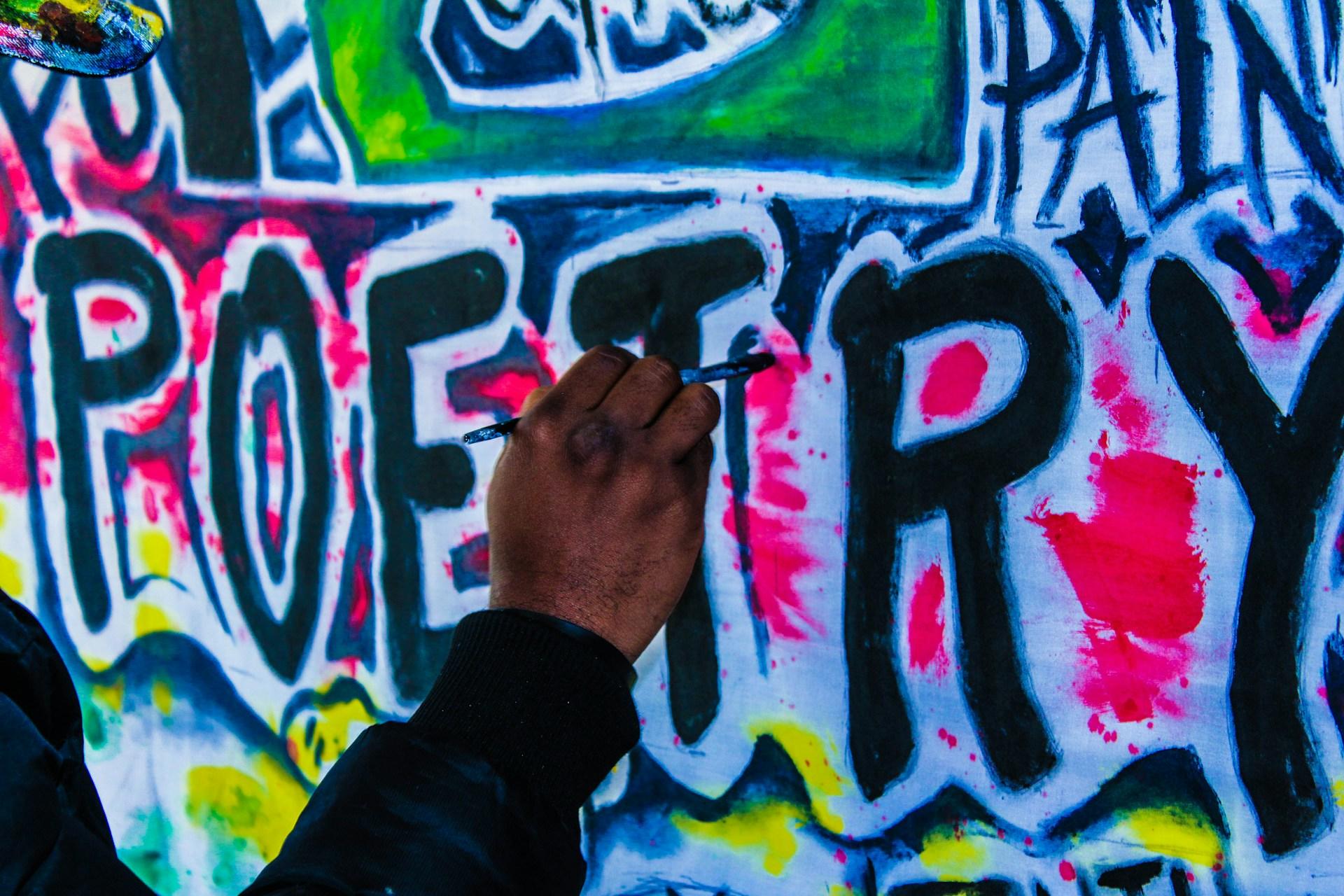 A graffiti artist working on the word 