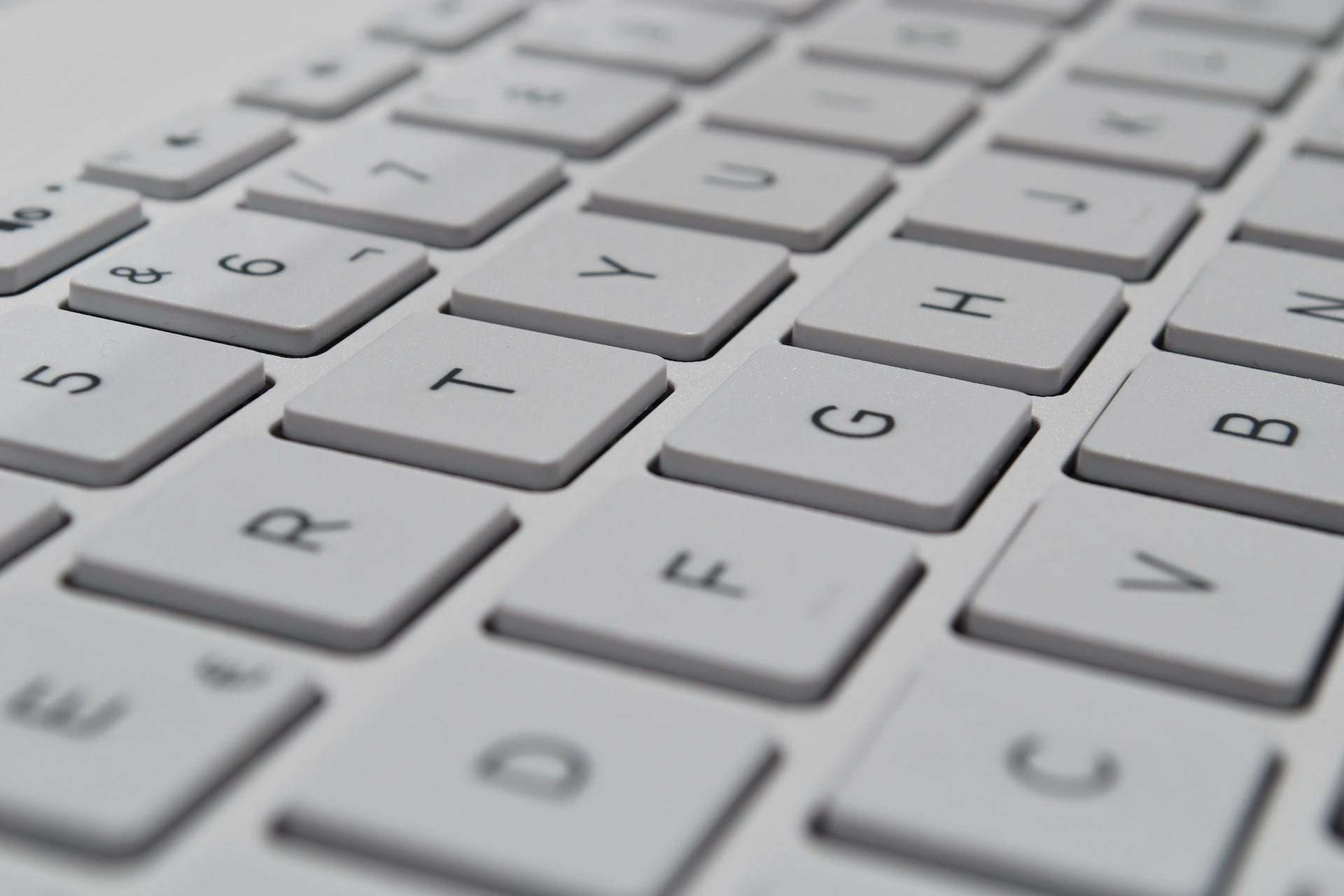 A close-up of a white computer keyboard.