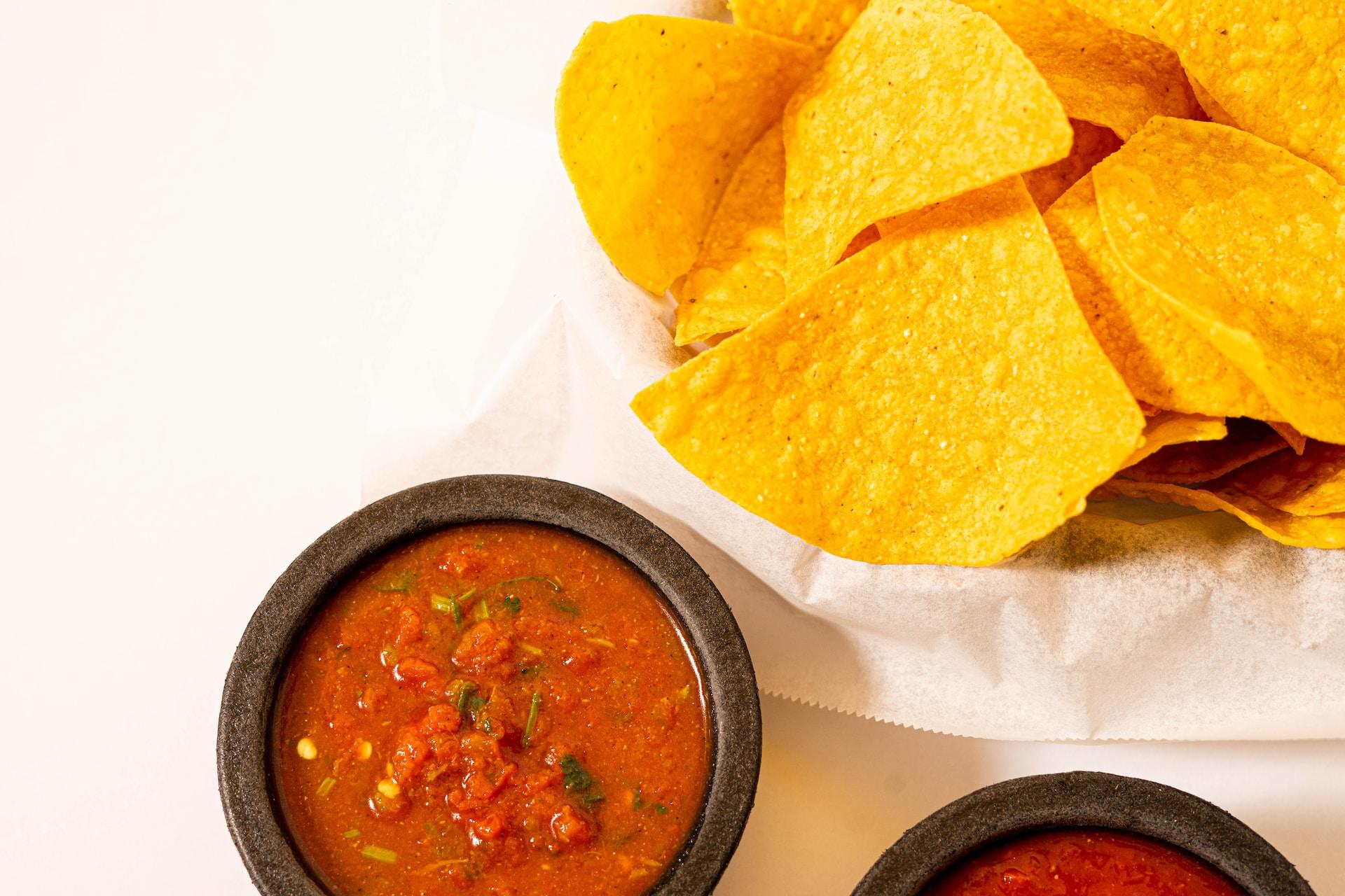 Some chips with a salsa dip.