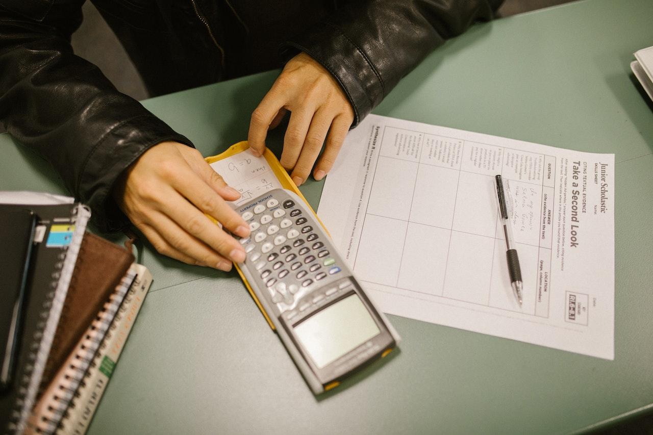 A student using a graphing calculator in maths class.