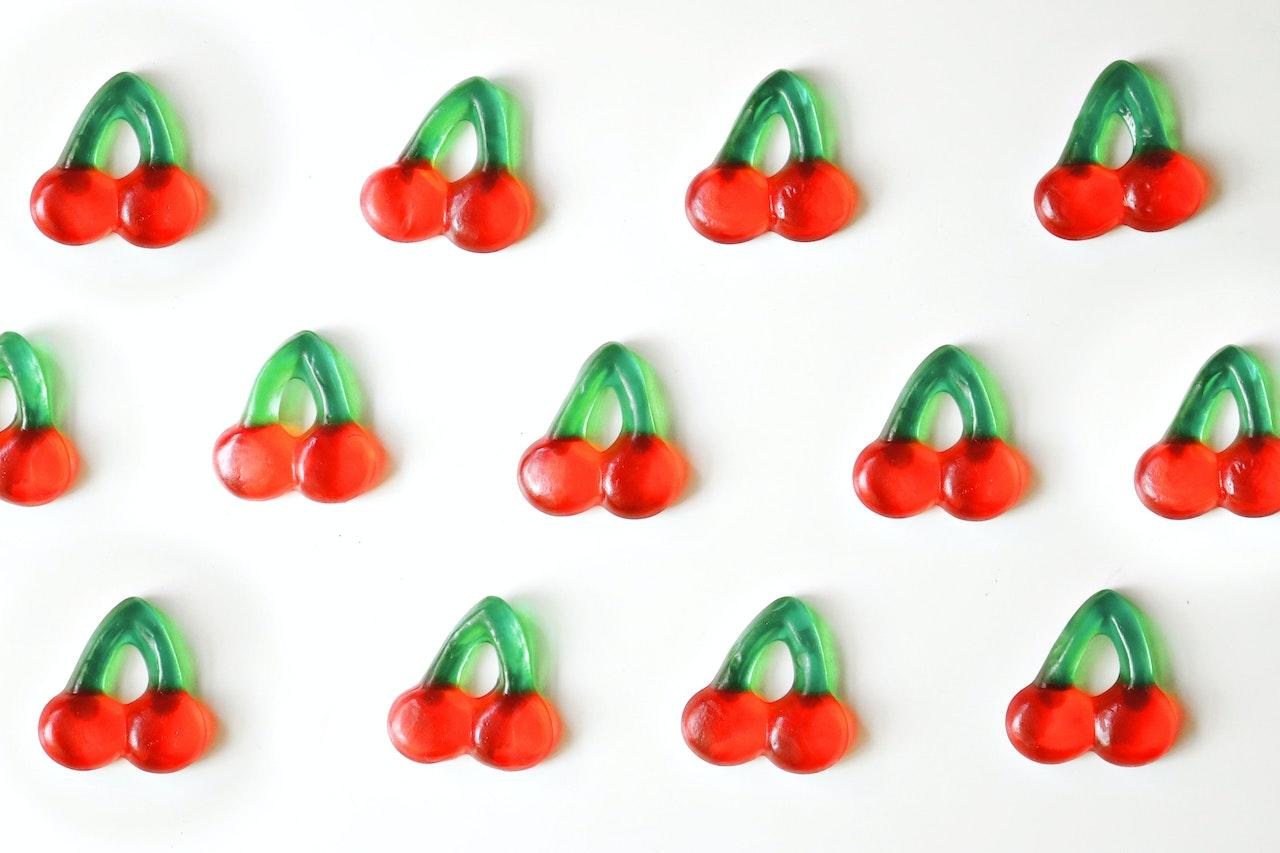 Exciting red and green gummy cherry candies.