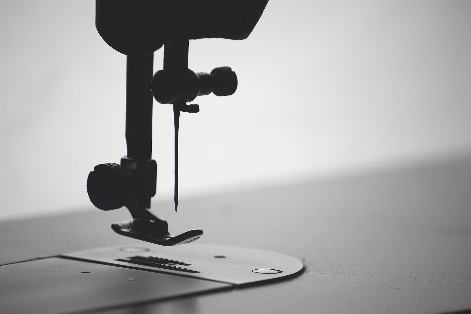A closeup of a sewing machine foot.