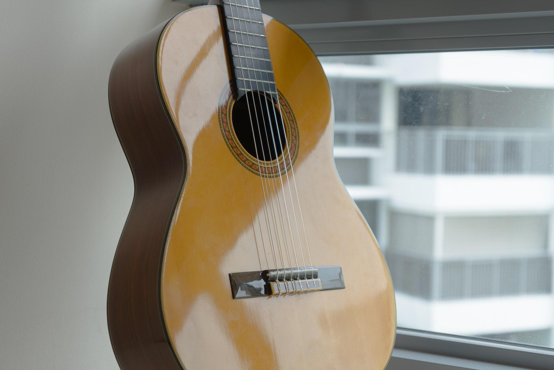 A classical guitar in an apartment.