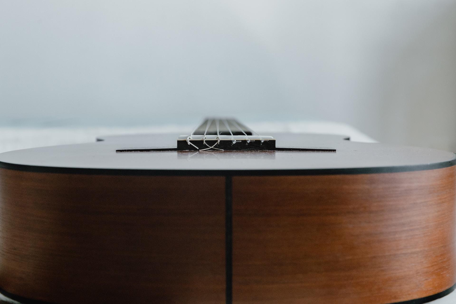 A closeup of the body of a classical guitar.