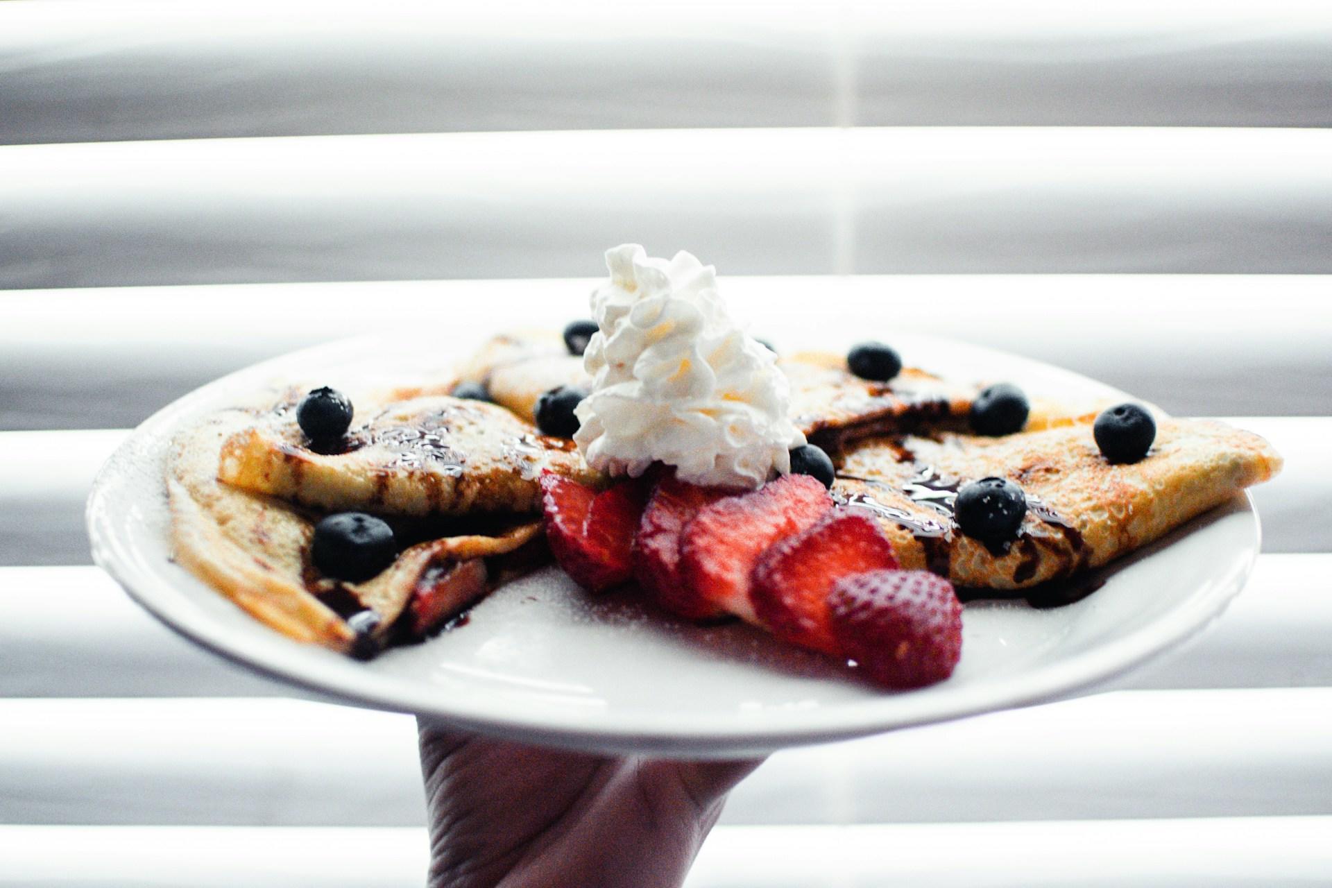 Crepes with berries and cream.
