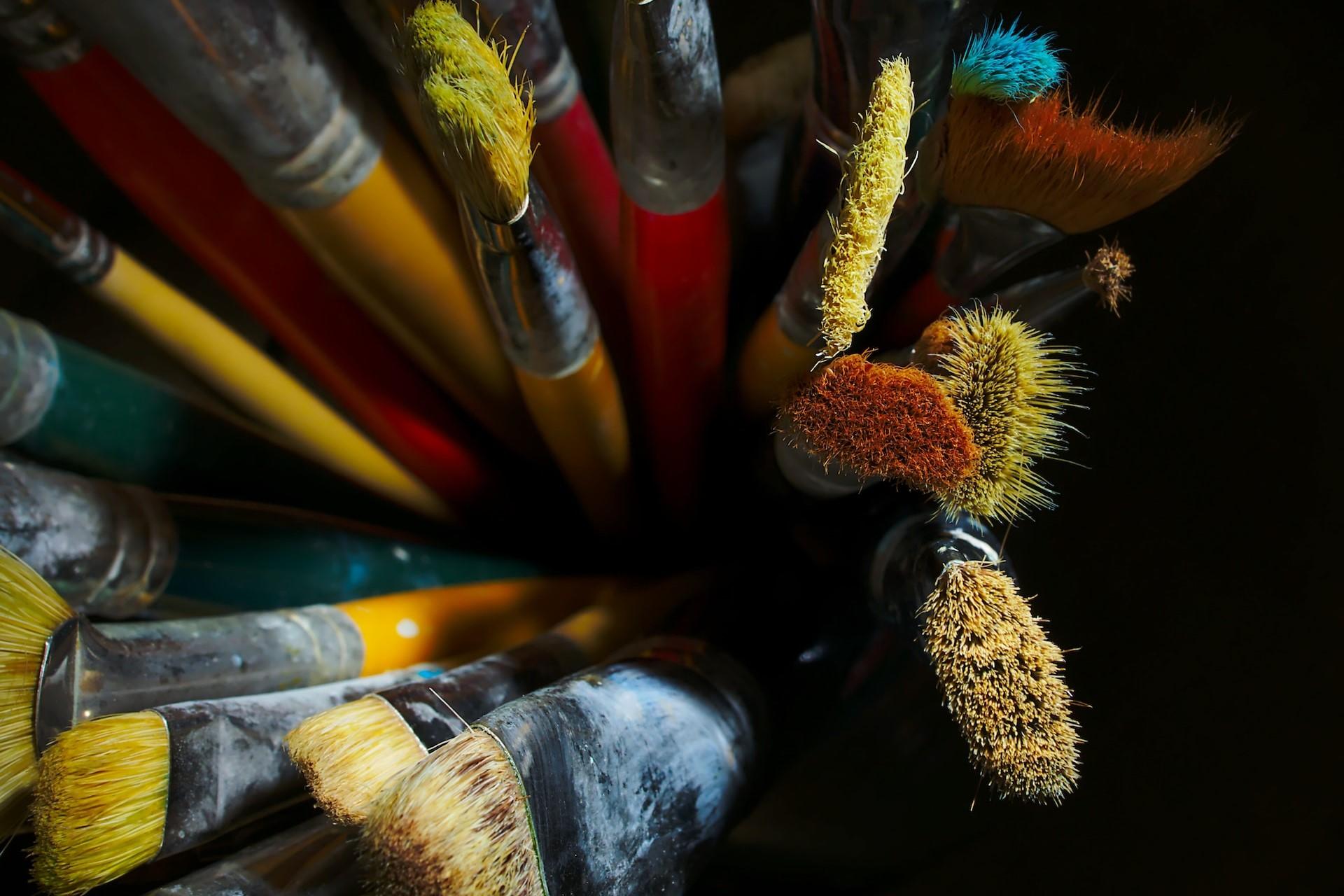 A view of some paint brushes from above.
