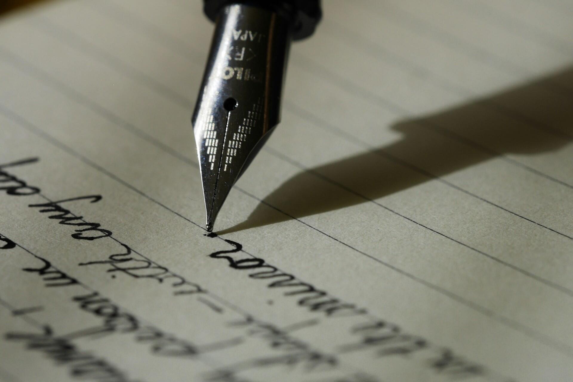 Fountain pen writing on lined paper