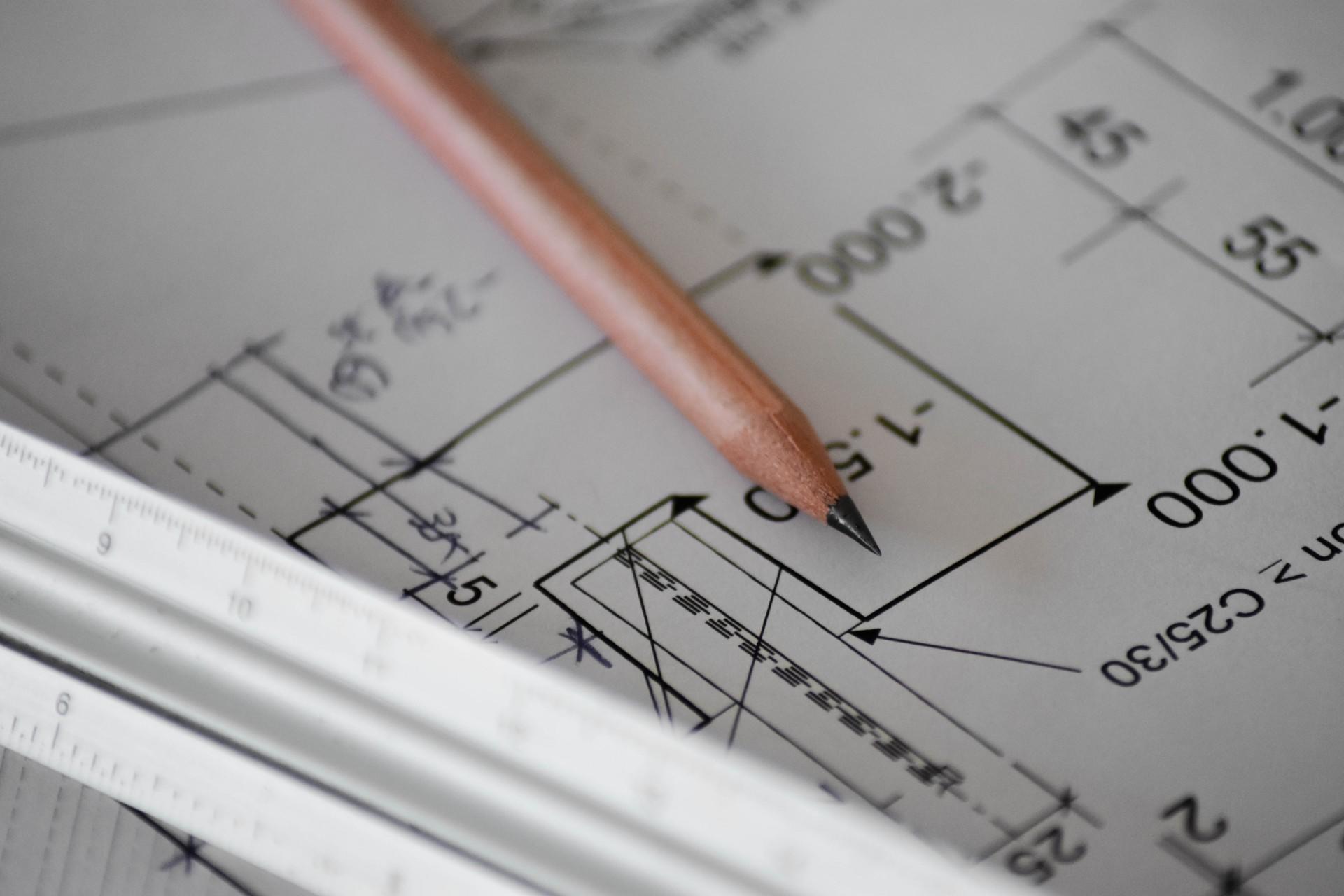 A pencil on a sheet with calculations