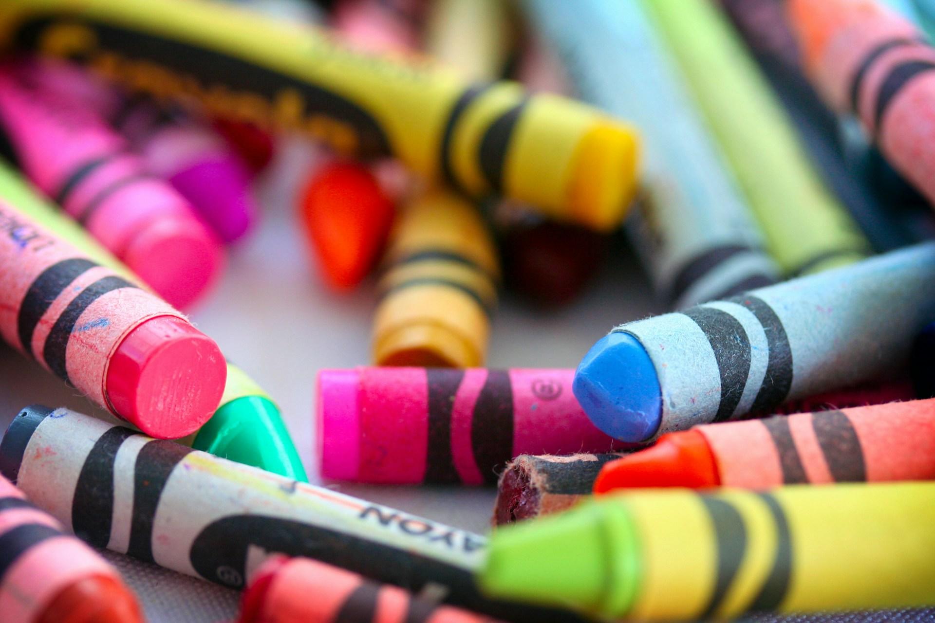 A pile of different coloured crayons.