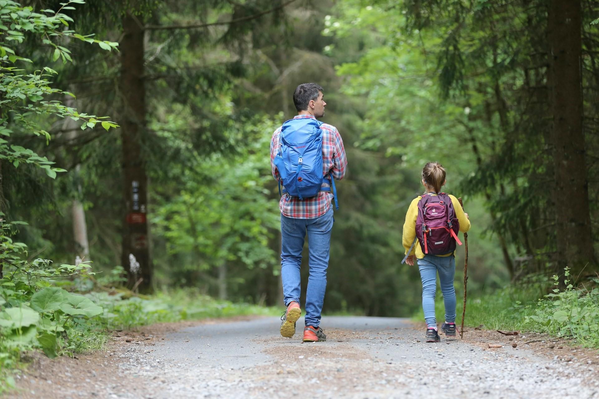 A father walking with his child.