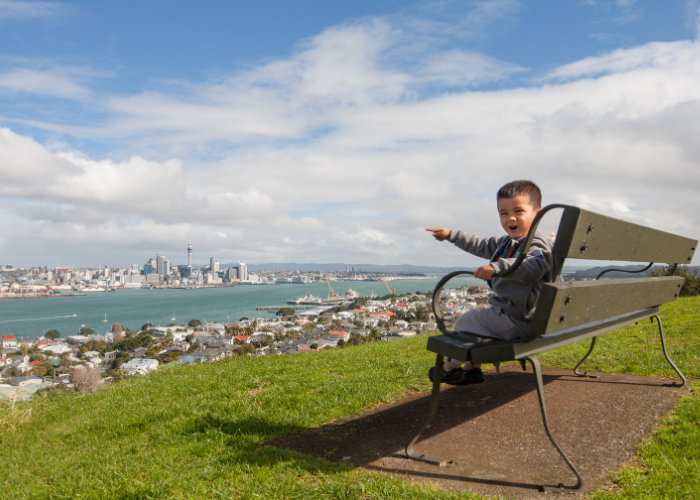 Young boy pointing towards Auckland because there are so many maths tutors in Auckland it's hard to choose.
