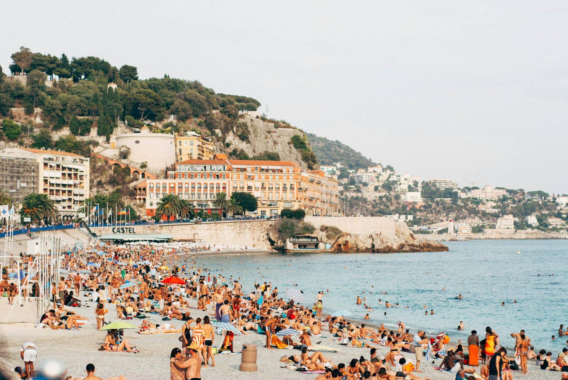 Holidaymakers on a beach in Nice, France.