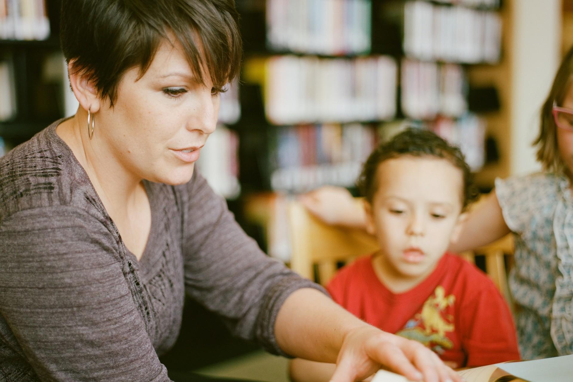 A tutor teaching children