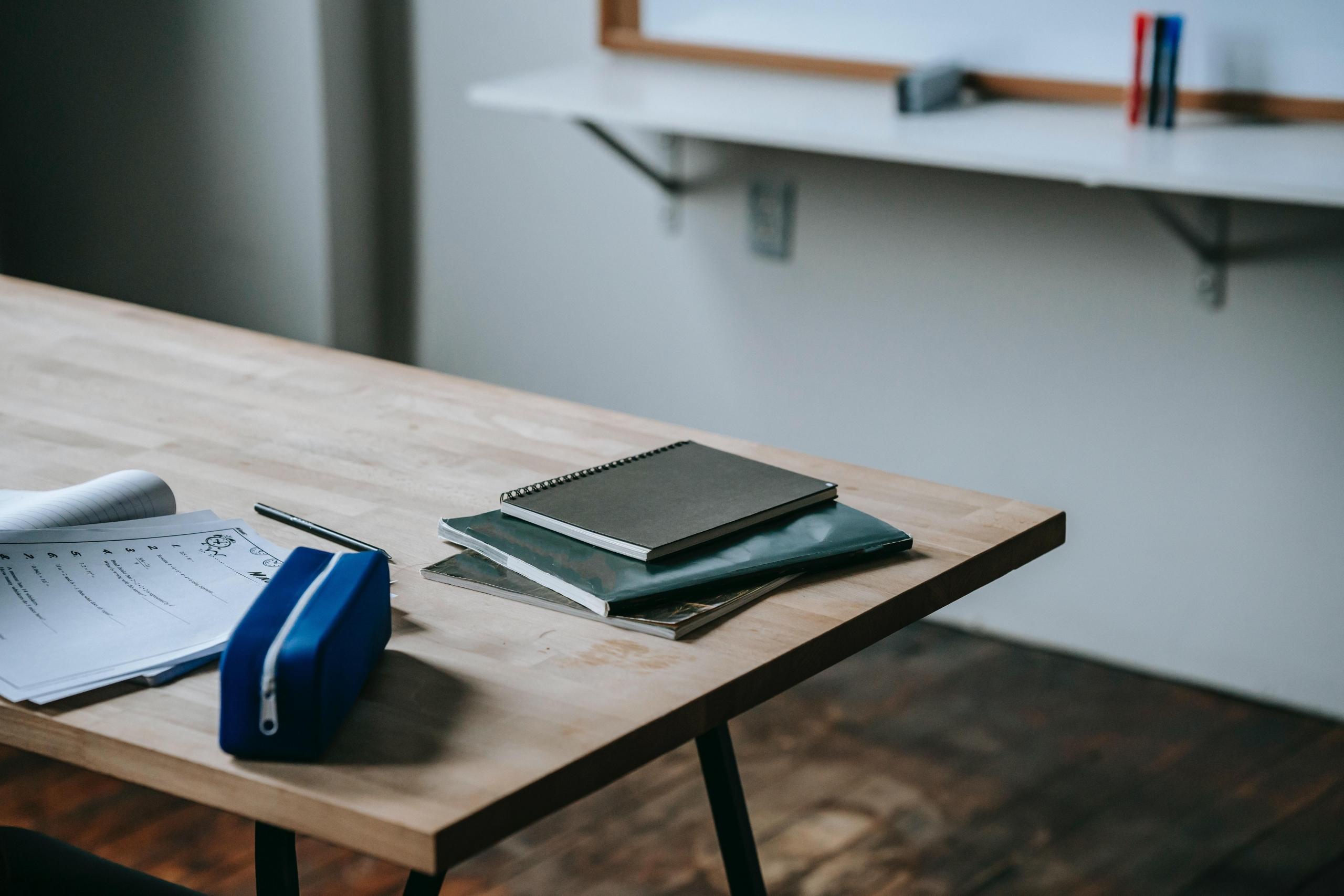 Books on a table in a classroom