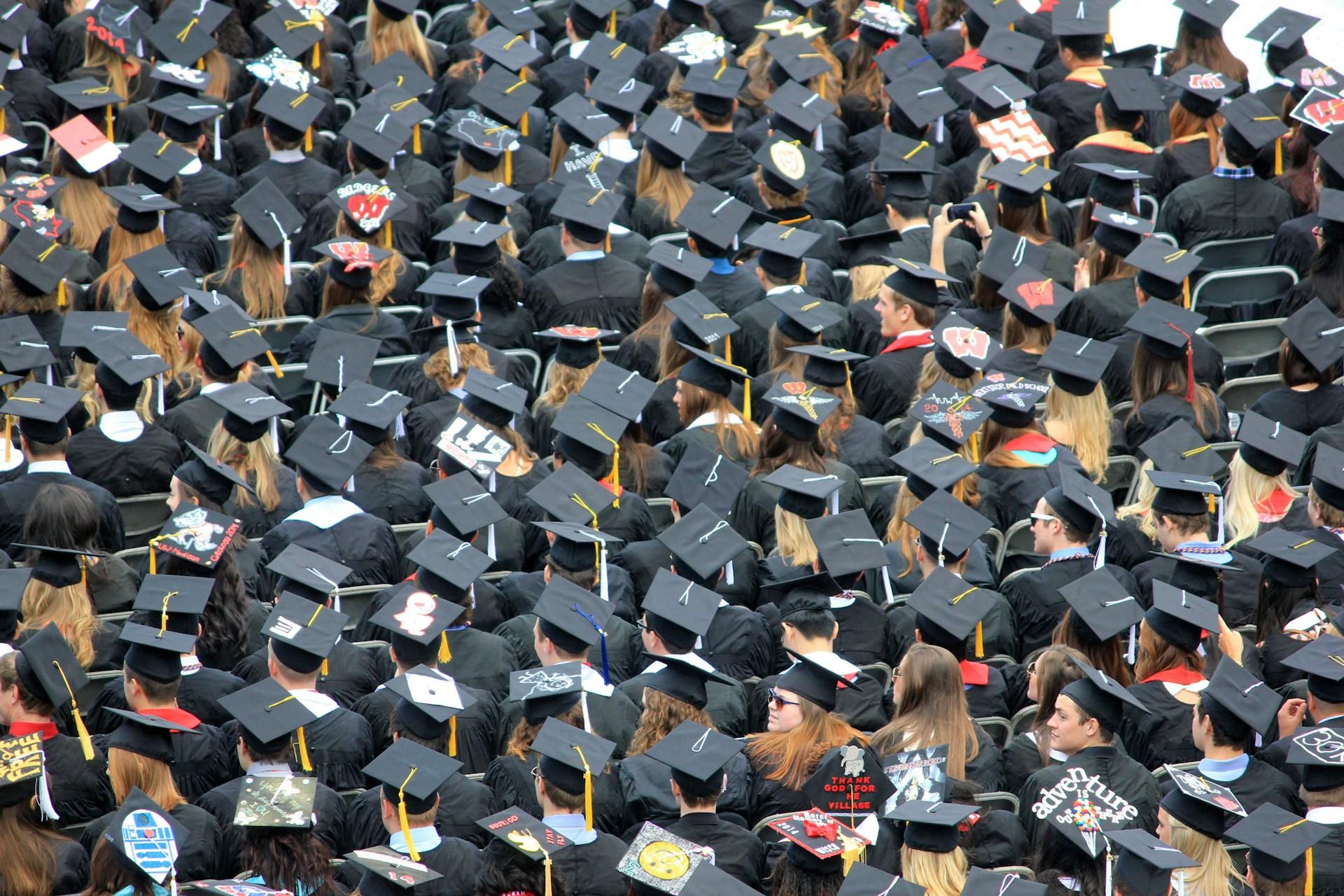 University graduates wearing the mortarboard hats.