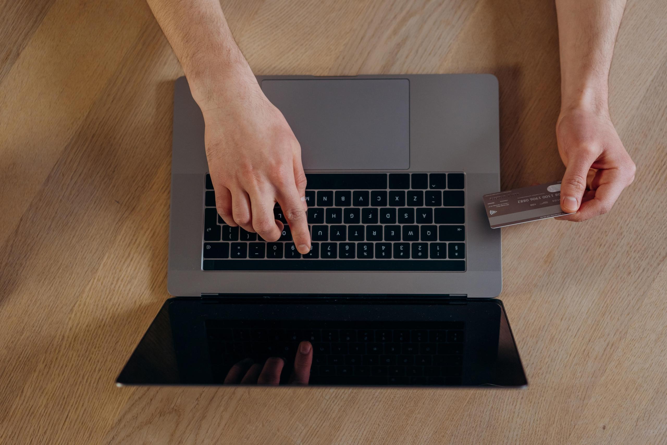Man with laptop and credit card
