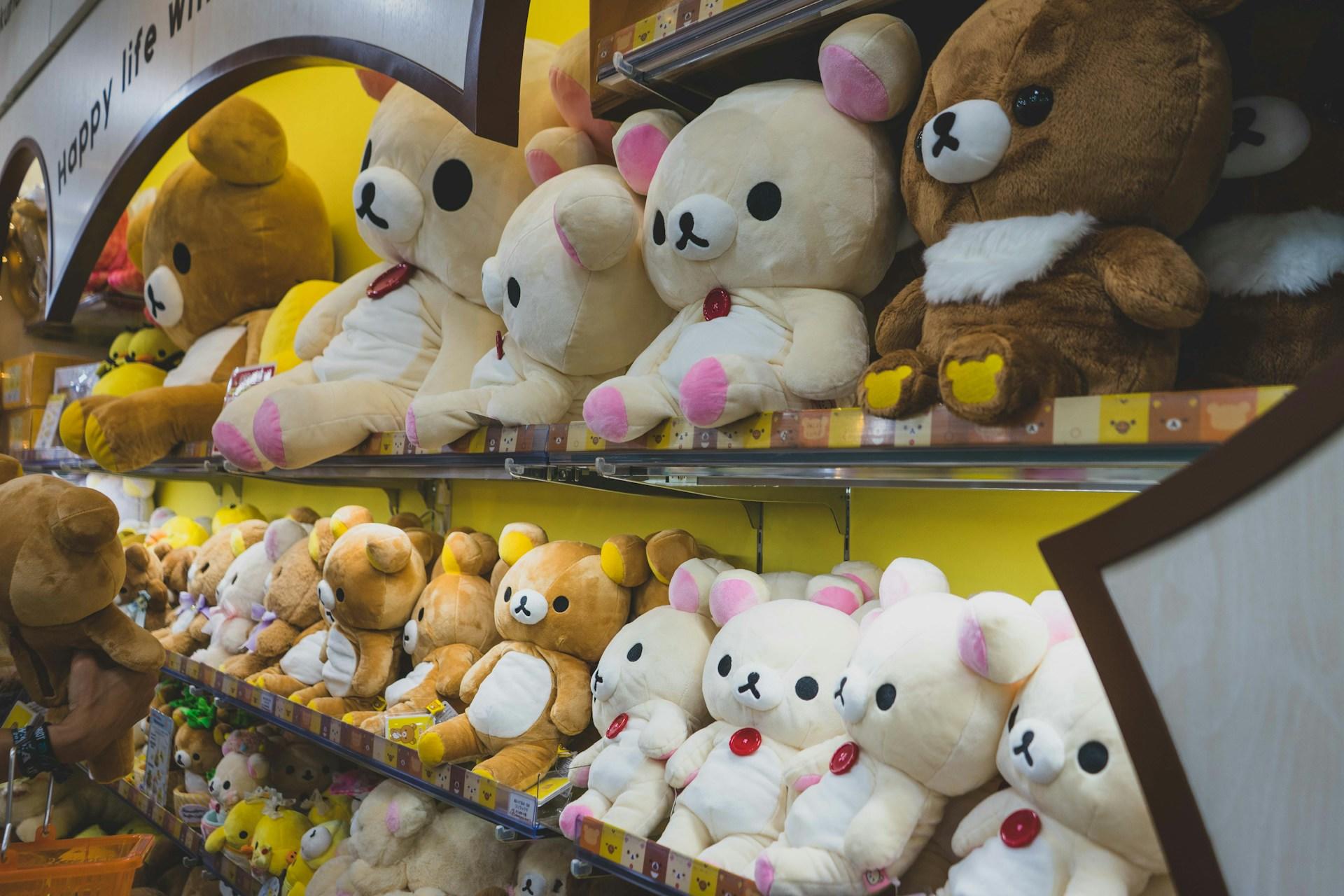 Kawaii stuffed animals on a shelf in a shop.