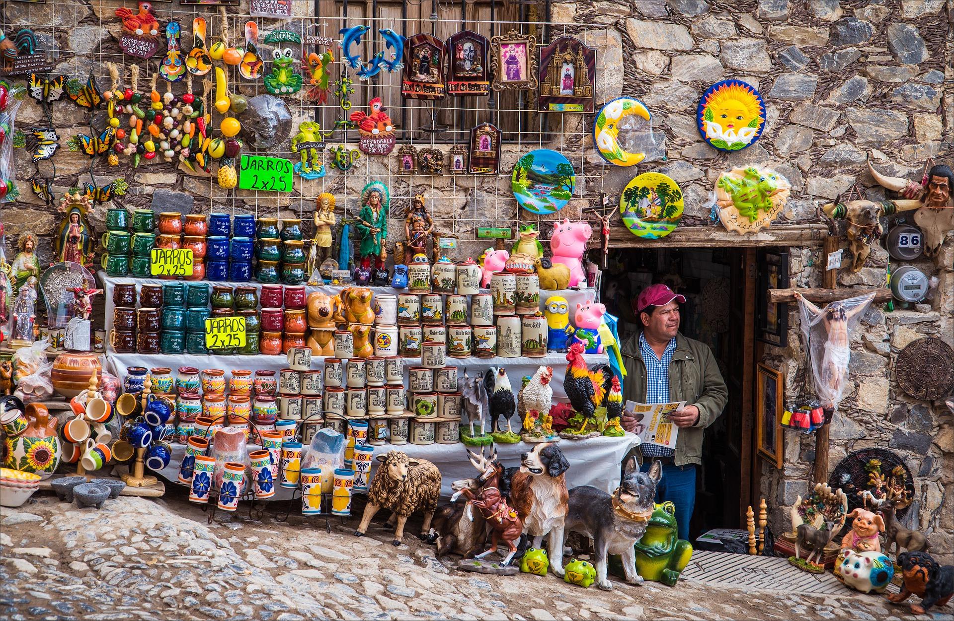 Man standing in doorway of mexican market