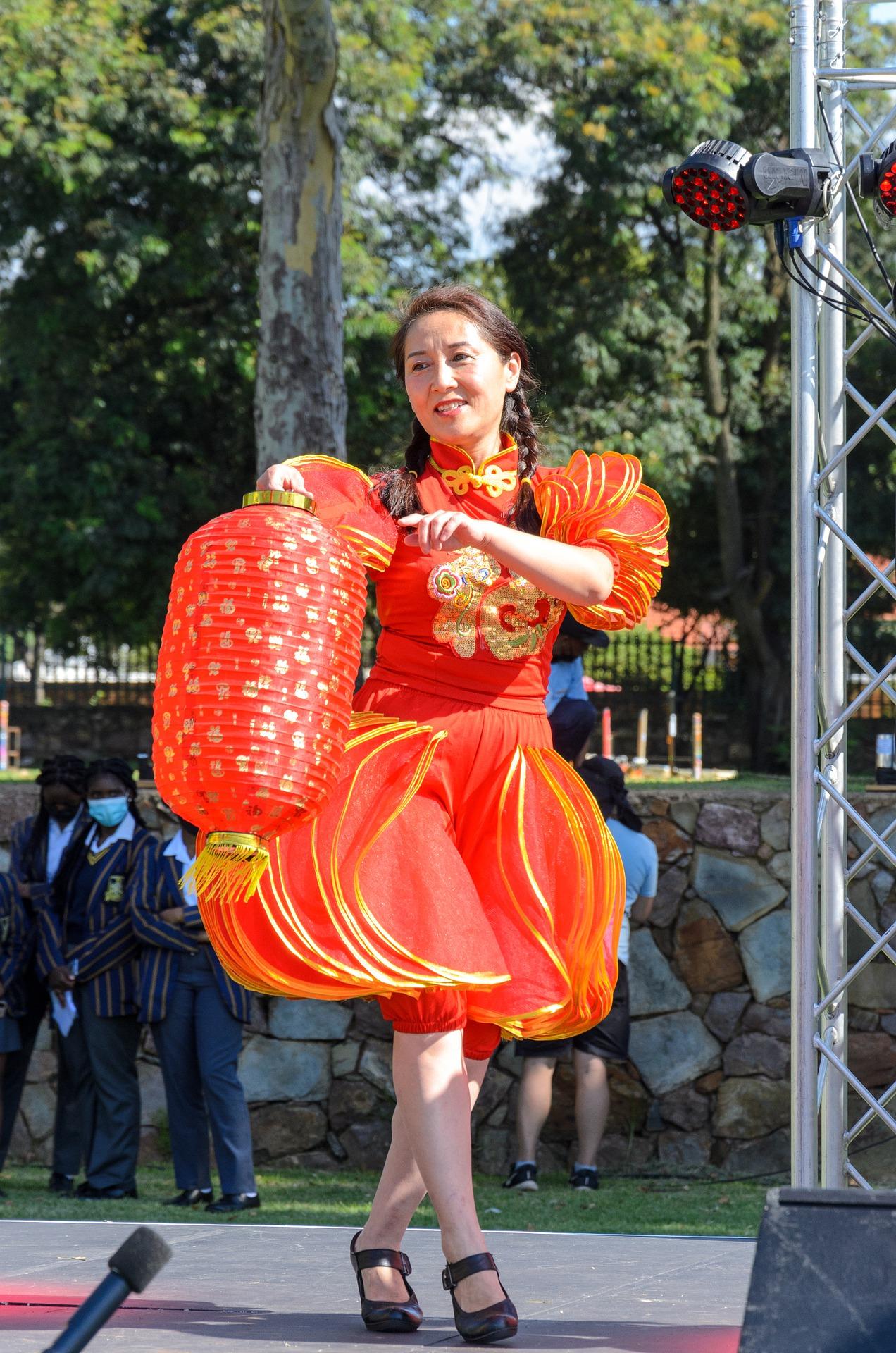 Chinese Woman in Red for New Years - Understanding culture is important to NCEA Chinese