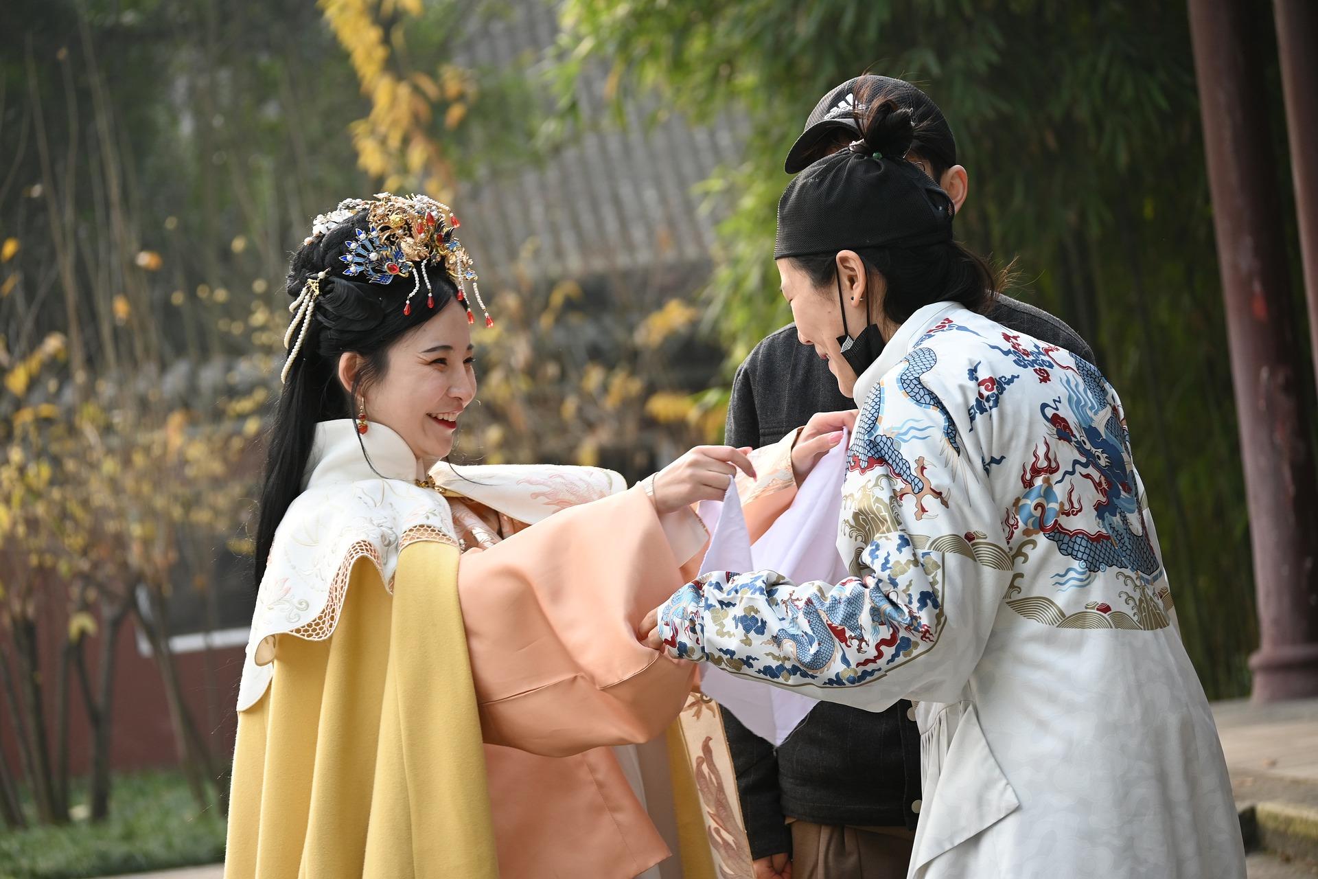 Three people wearing traditional hanfu dress - Chinese langage buddies for NCEA Chinese