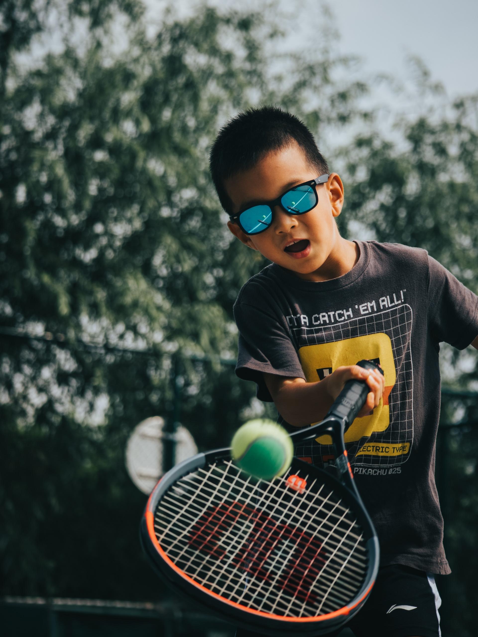 Boy playing tennis