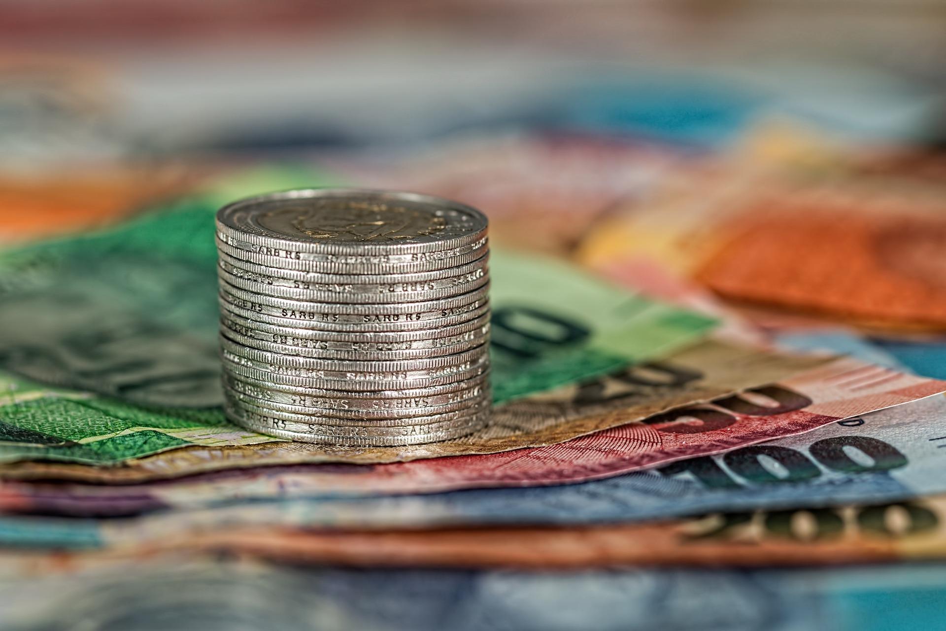 Coins on money notes