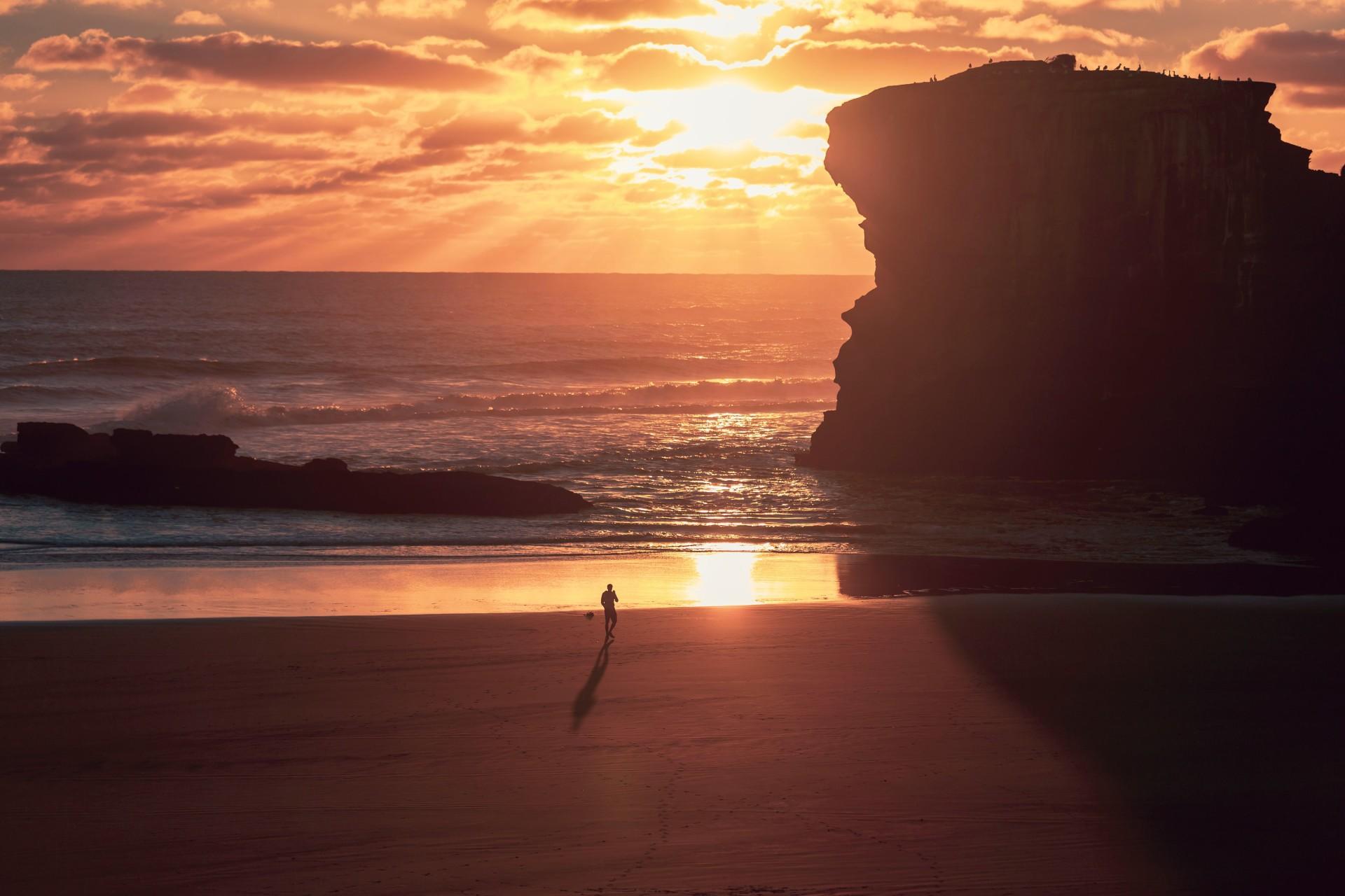 A man walking on a beach