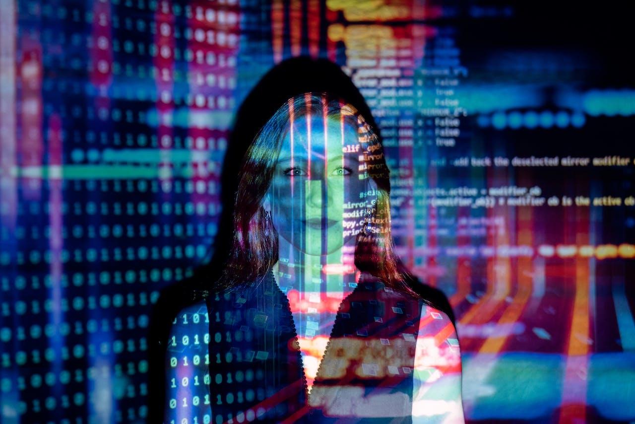 a girl with computer code projected onto her face