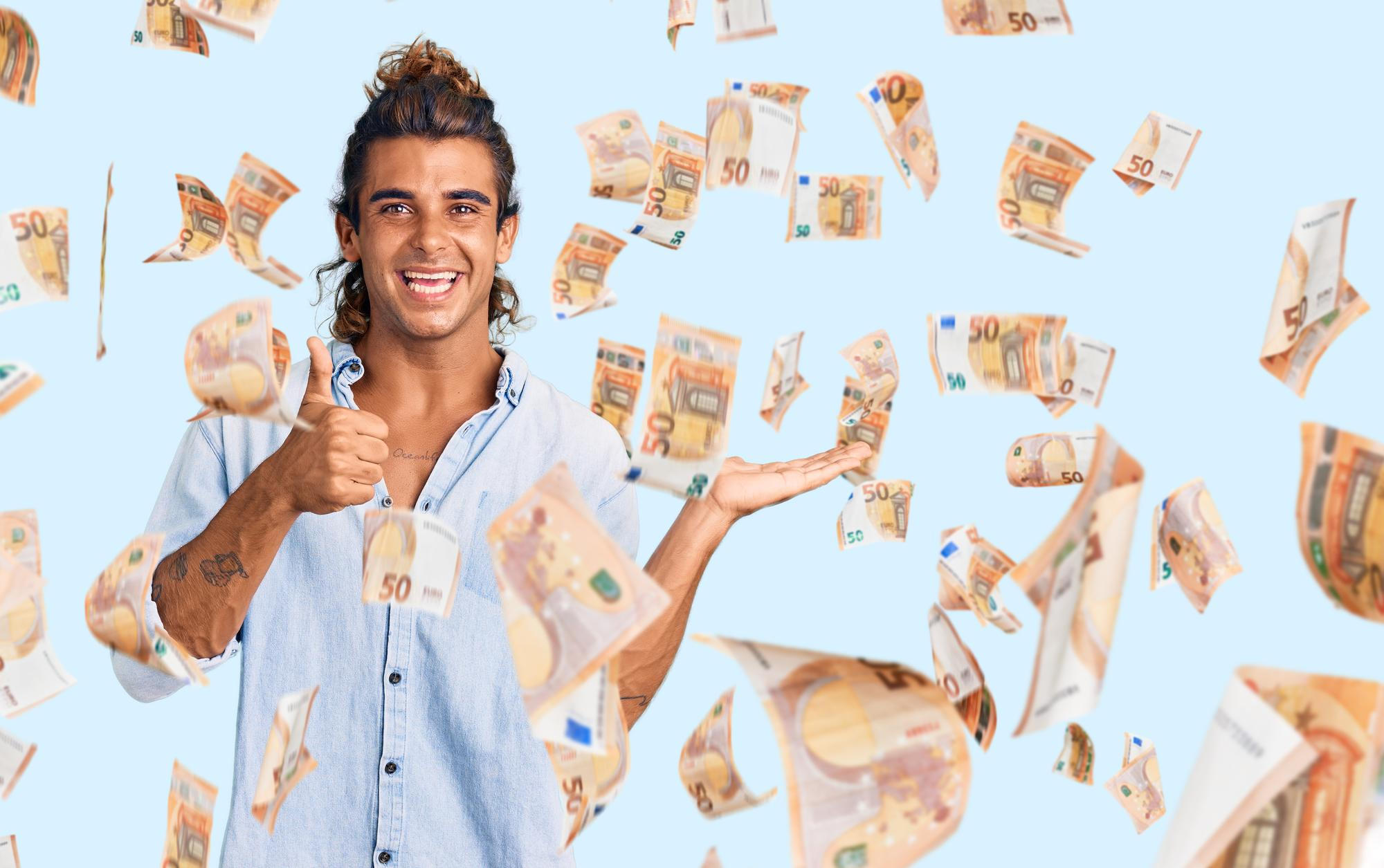 A man standing among money raining down