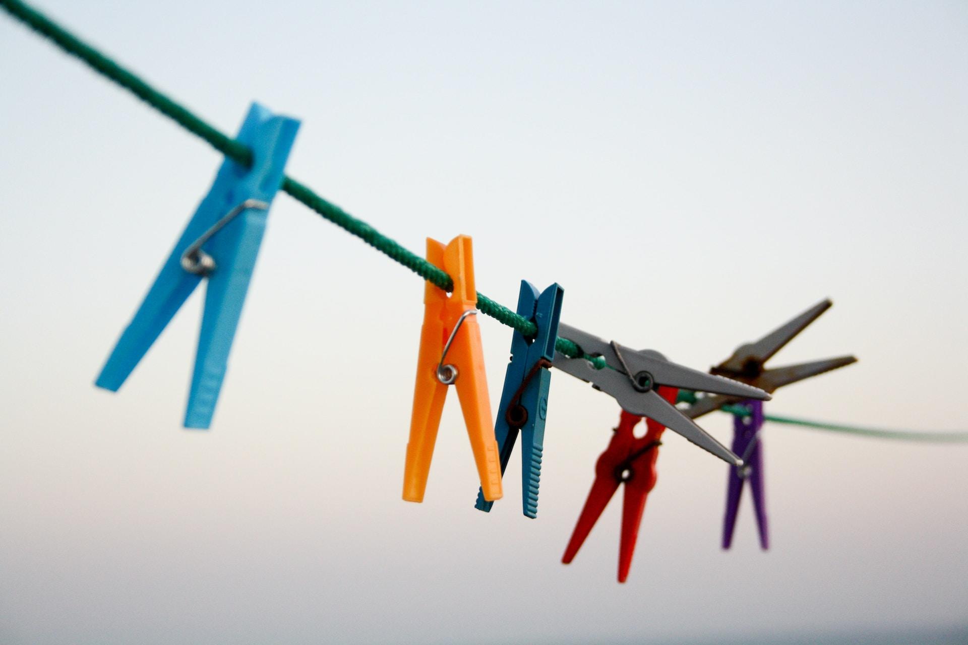 Clothes pegs on a washing line.