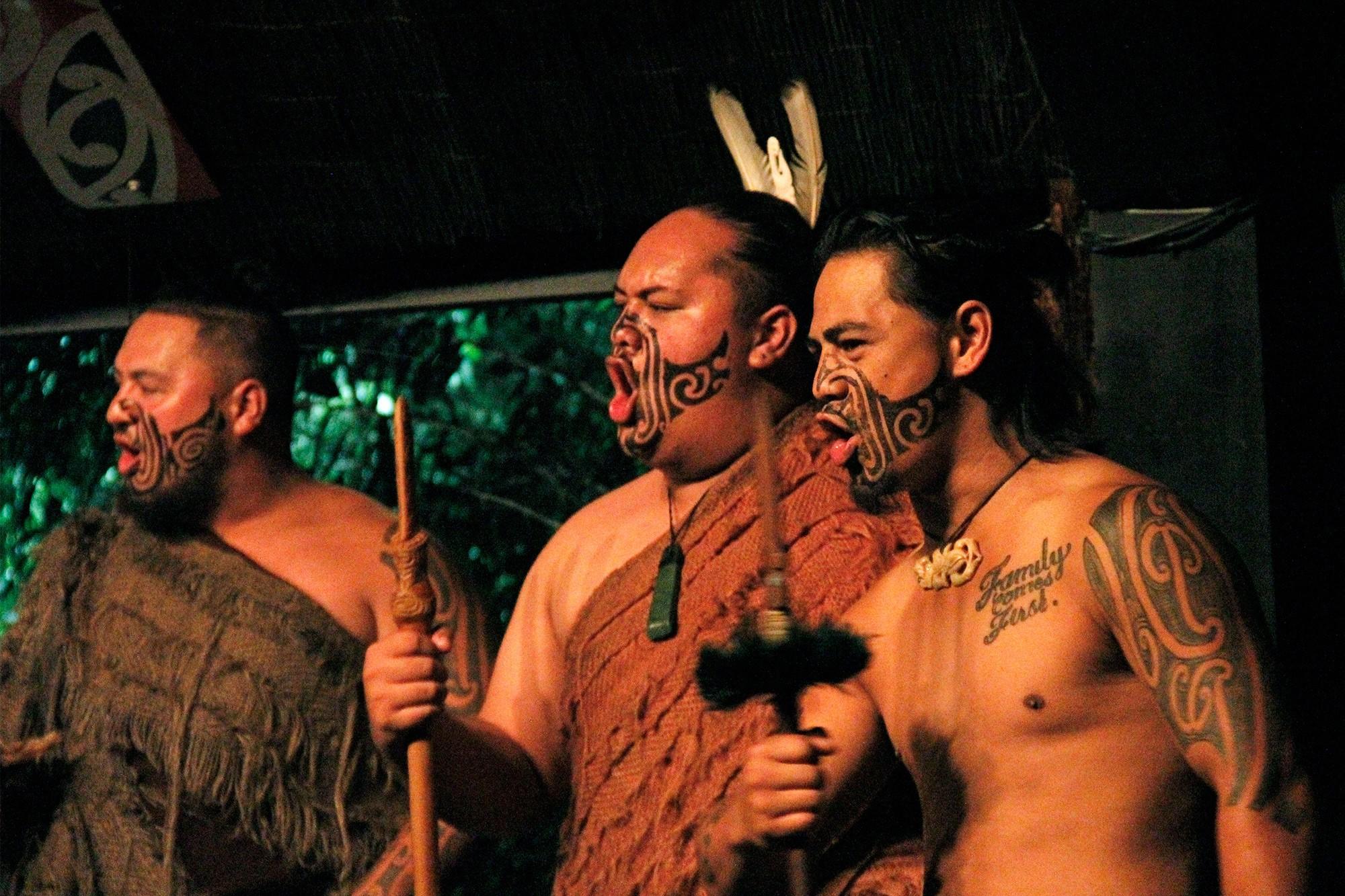 3 Maori dancers performing haka