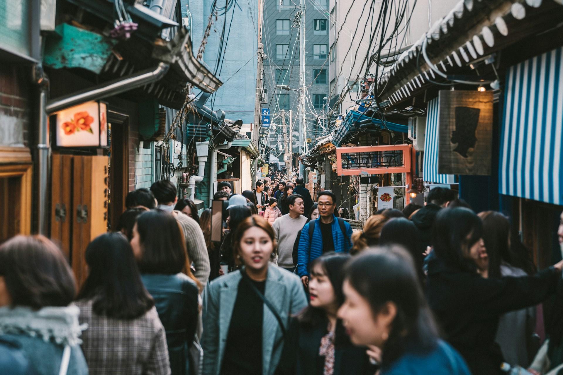 People in a busy street in South Korea.