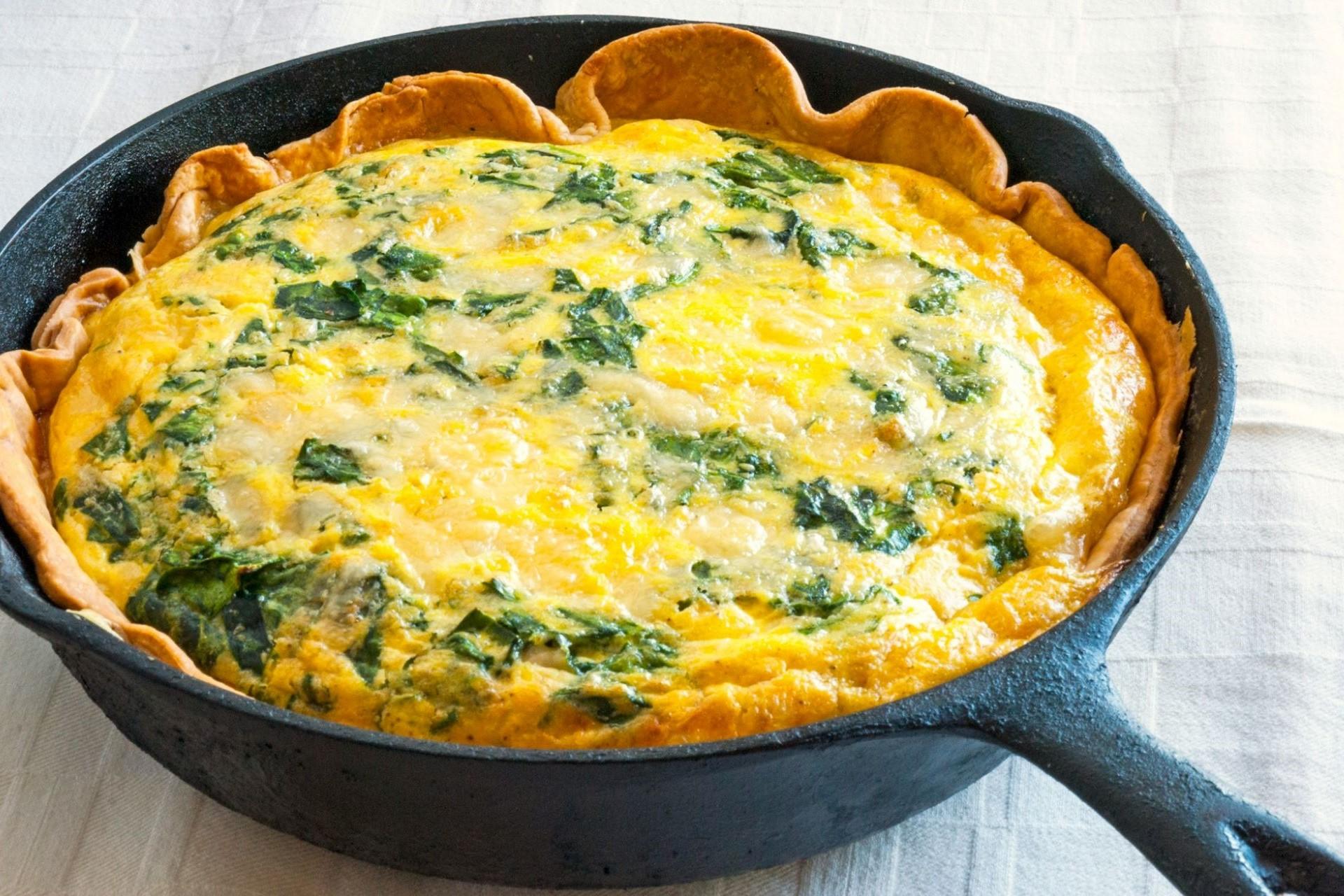 A quiche that's been cooked in a skillet.