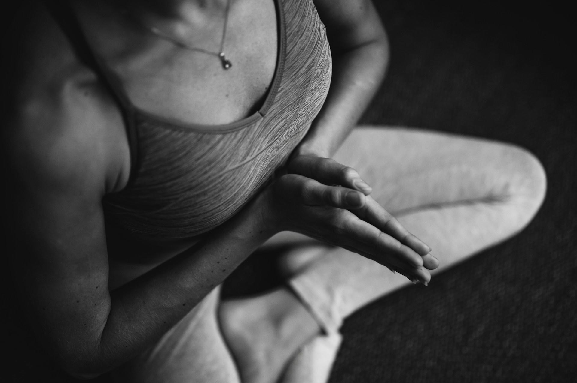 A closeup of a woman doing yoga.