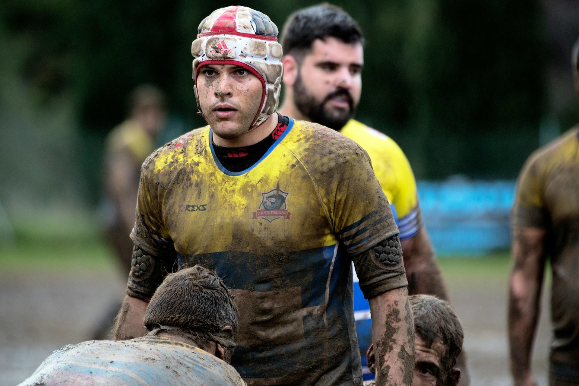 A muddy rugby player.