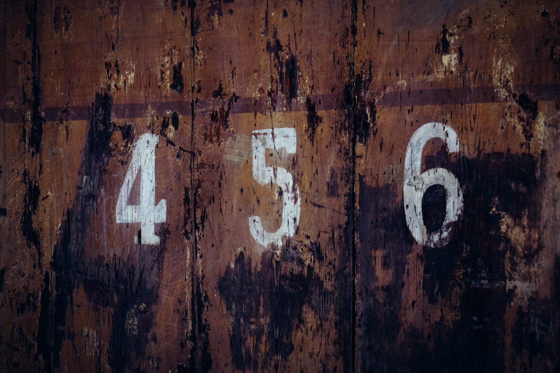 The numbers 4, 5, and 6 on a wall.