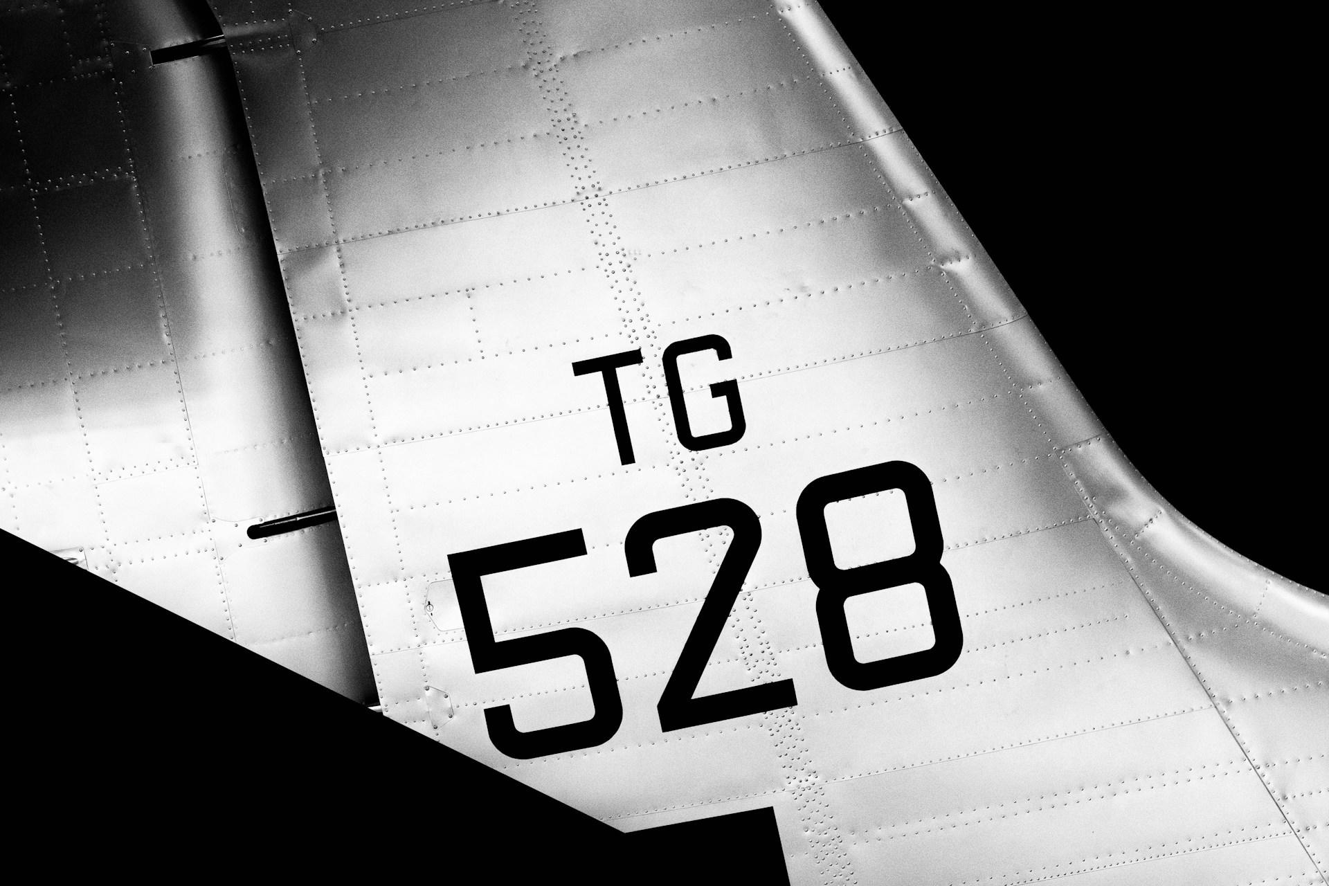 The number "528" on the wing of a plane.