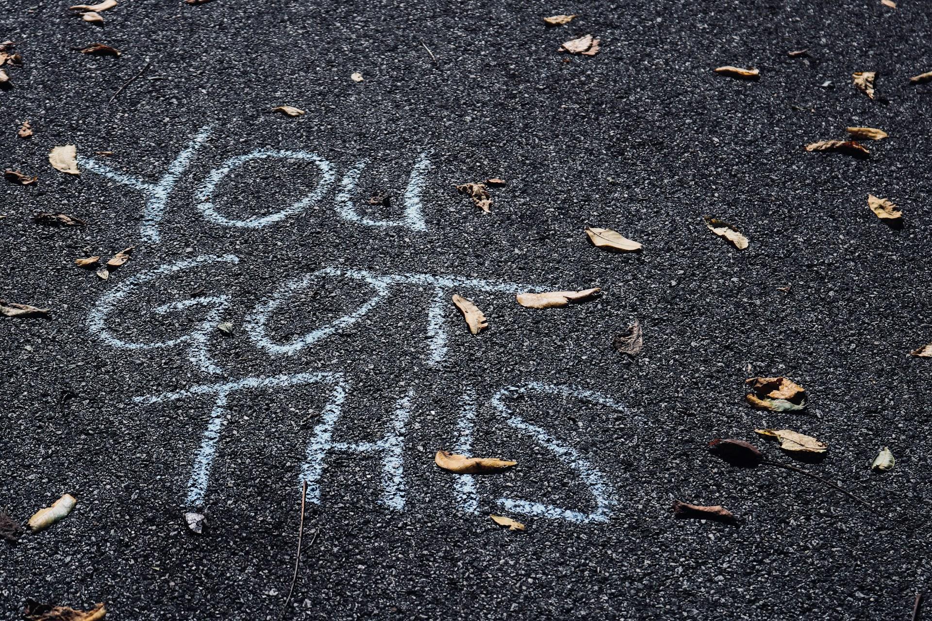 "You got this" written on the pavement in chalk.
