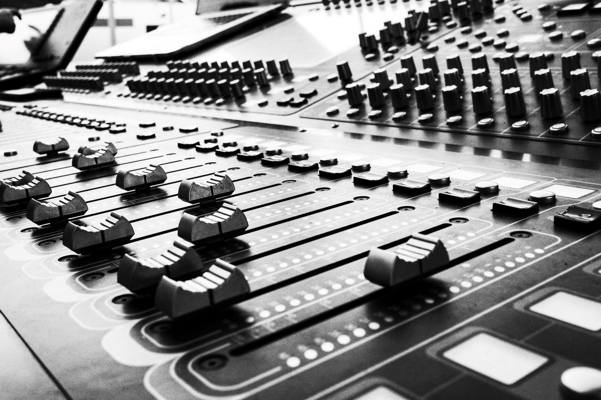 A black and white photo of a mixing desk.