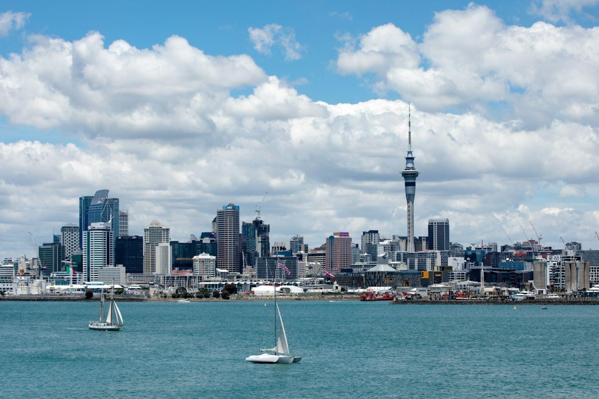 Auckland skyline with Sky Tower and boats on the harbour in New Zealand