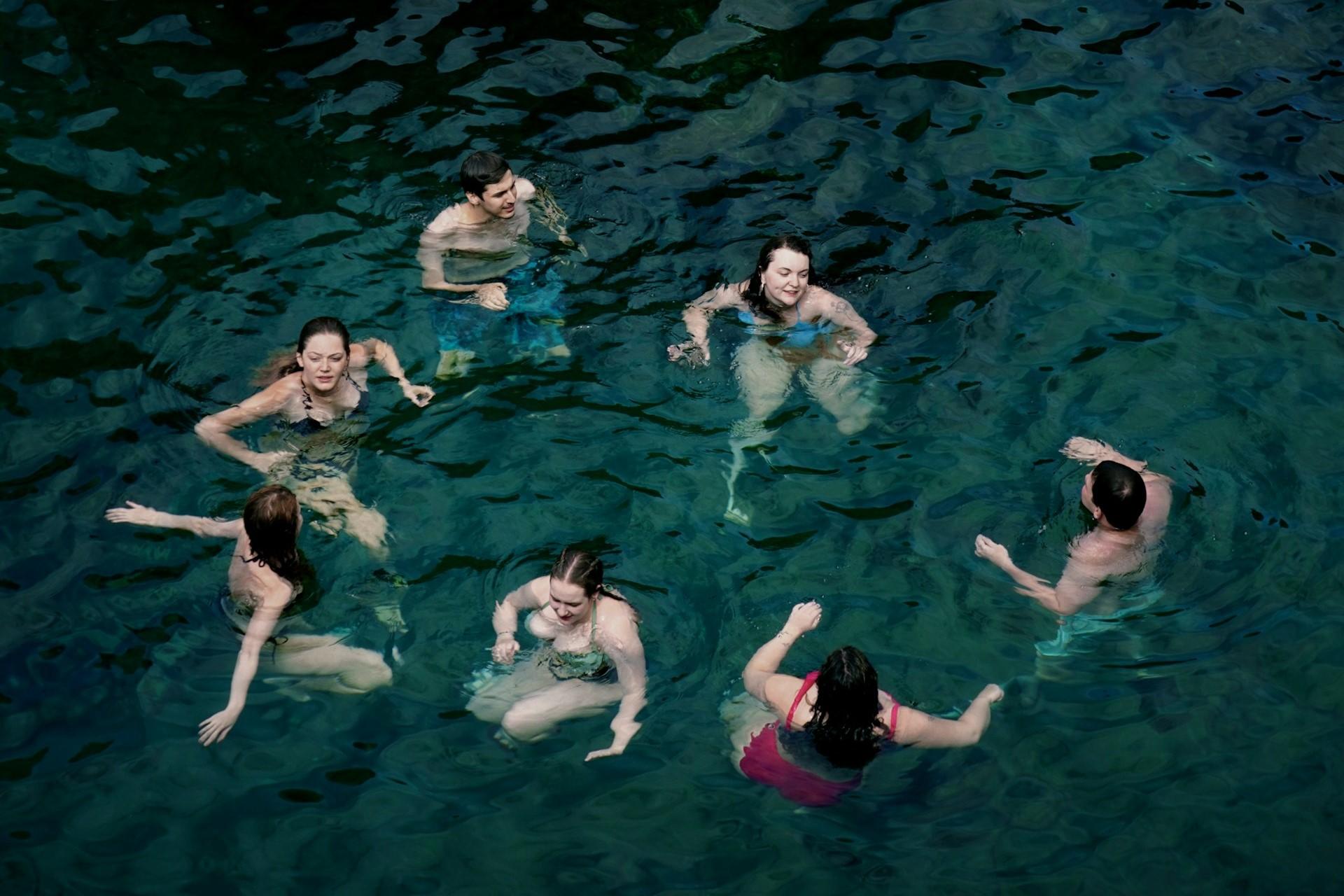 A group of people swimming together.